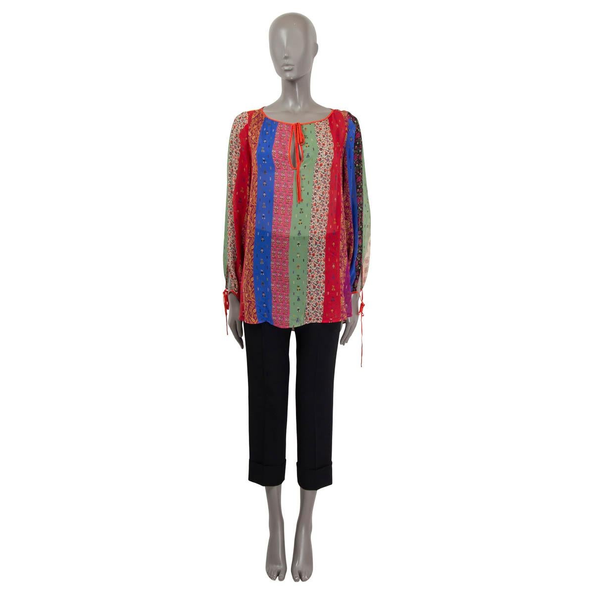 100% authentic Etro peasant blouse in silk (100%) pink, red, blue and purple with various multicolored paisley-printed patchwork stripes. Featuring keyholed-neck that ties with a cord around the neck and around wrists. Has been worn and is in