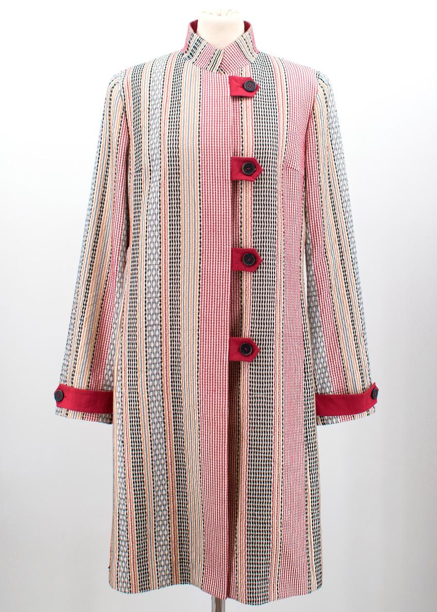 High neck cotton coat with embroidered multicoloured stripes and four buttons in the middle.
Measurements are taken laying flat, seam to seam. 

Shoulders: 41 cm 
Chest: 40 cm 
Waist: 40 cm 
Length: 96 cm 
