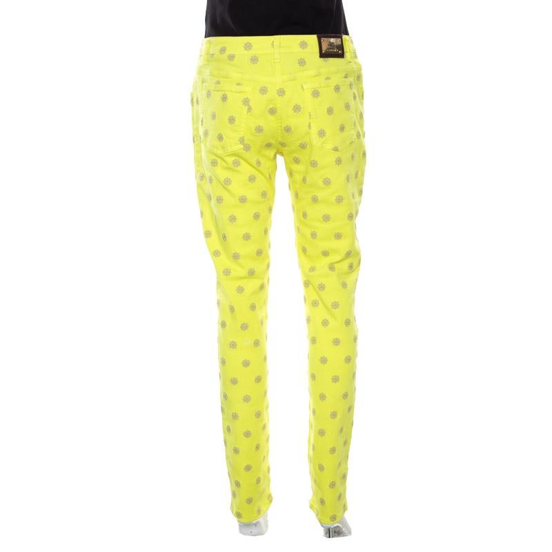 Pair these lovely skinny jeans from Etro with pointed stilletoes and you're all set to make a statement. The neon yellow jeans are made of a cotton blend and feature geometric embroidered motifs all over them. They come equipped with a front button