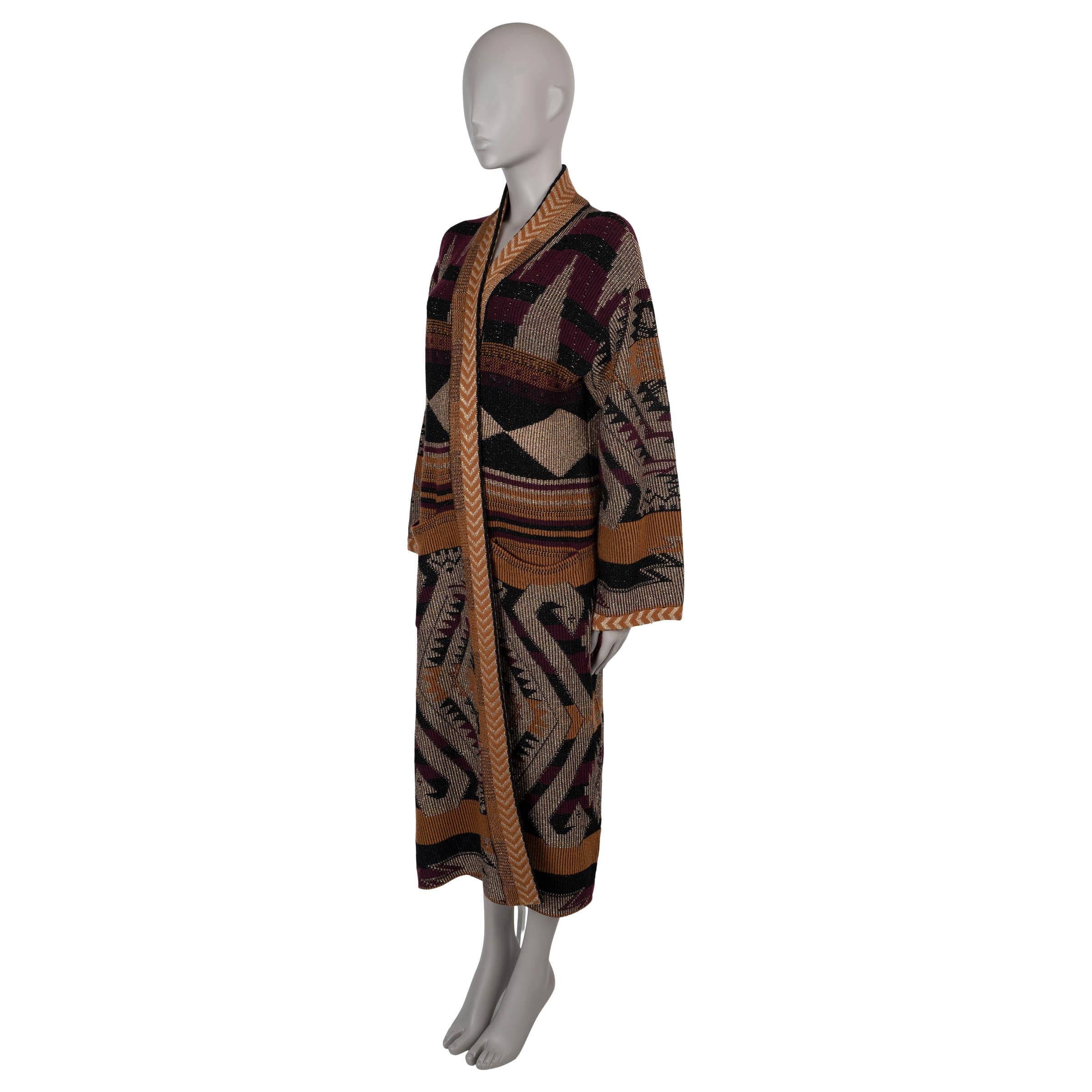 This 100% authentic Etro long cardigan is crafted in a luxurious ochre, metallic silver, black, and burgundy jacquard knit, blending viscose (56%), wool (22%), metallized fiber (11%), cupro (5%), polyester (4%), and cashmere (2%) (please note the
