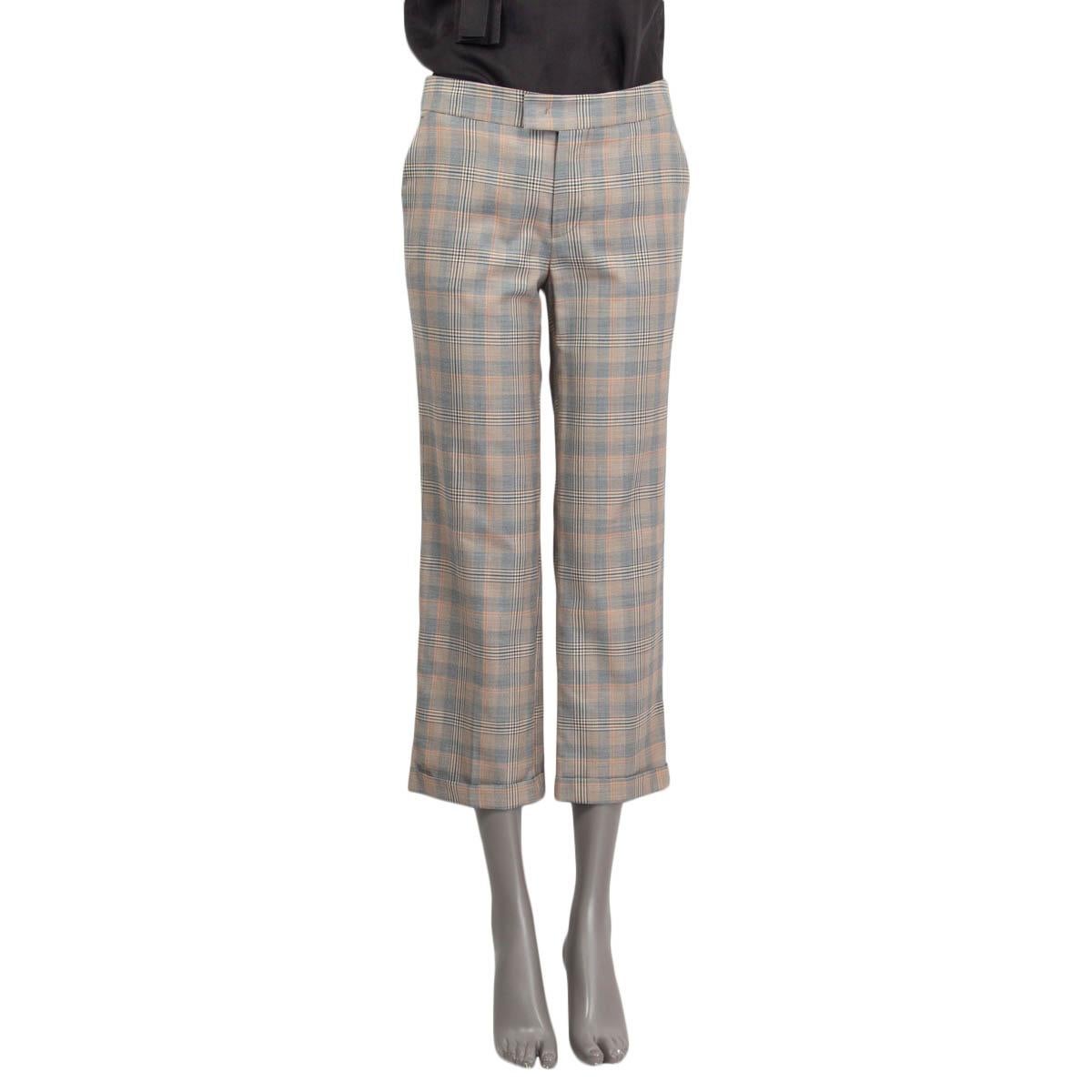 100% authentic Etro mid-calf plaid pants in brown, orange, gray and beige cotton (50%), laine wool (42%) and silk (8%). Comes with two slit pockets on the front and two slit pockets on the back. Opens with a concealed button, hook and zipper on the
