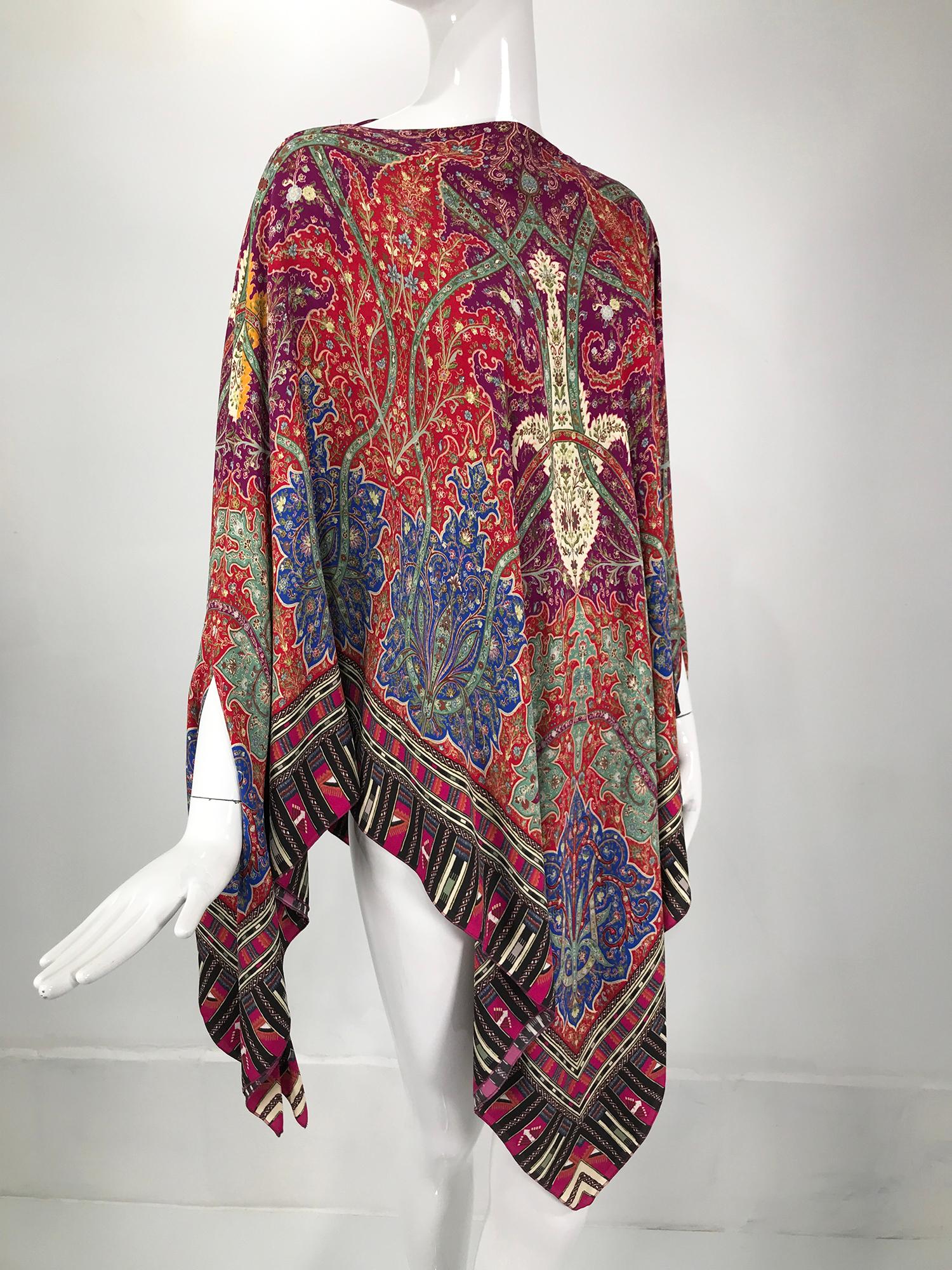 Etro paisley poncho/cape. Viscose/silk blend pull on poncho/cape, double layer fabric with interior French seaming. At the sides there are seam openings, two on each side for your arms. The fabric drapes beautifully, the print is gorgeous with lots