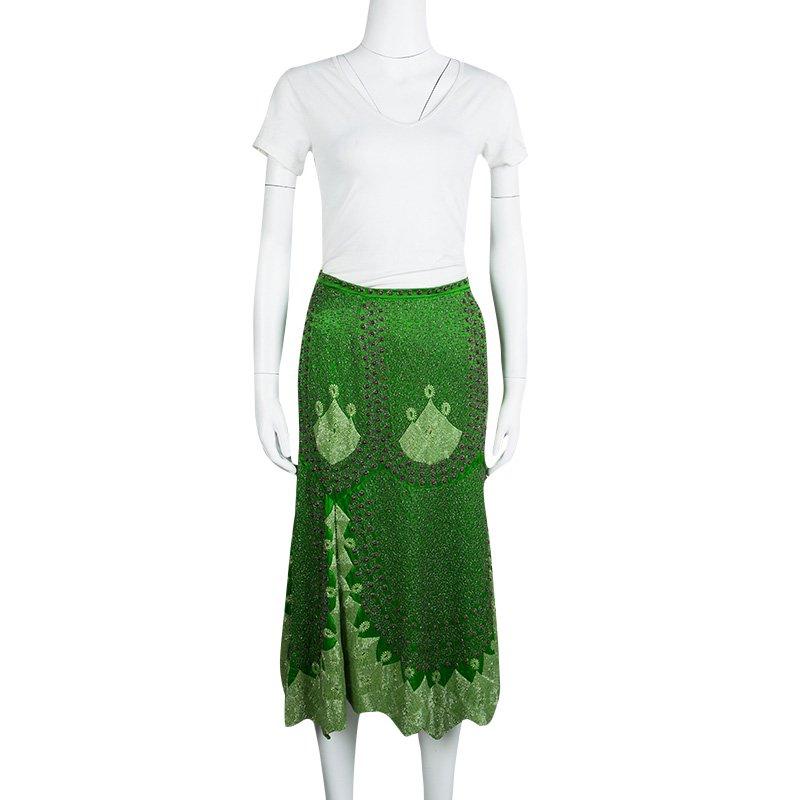 This Etro midi skirt is cut from 100% soft silk fabric. With an enticing green color, the midi skirt has an all-over print and is hand embellished with beadwork. To balance the busy print pair it with solid colored blouses and shirts.

Includes: The