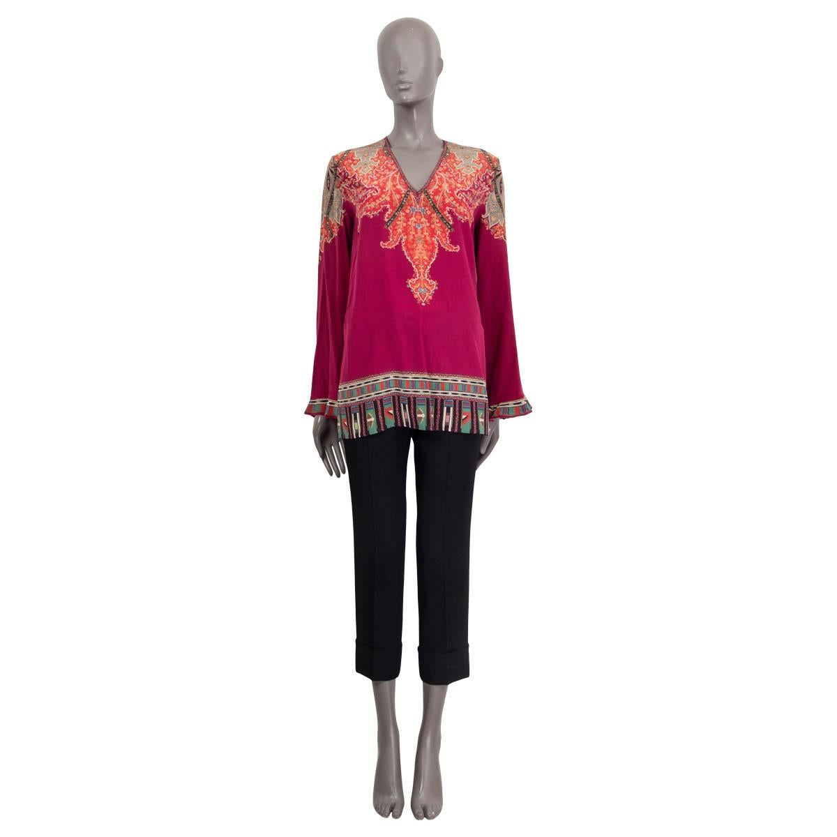 100% authentic Etro long sleeve tunic blouse in burgundy, red, black and pale sage silk (100%). Features a v-neck, a paisley print and slits on the side. Unlined. Has a barely visible stain at the armpit otherwise in excellent