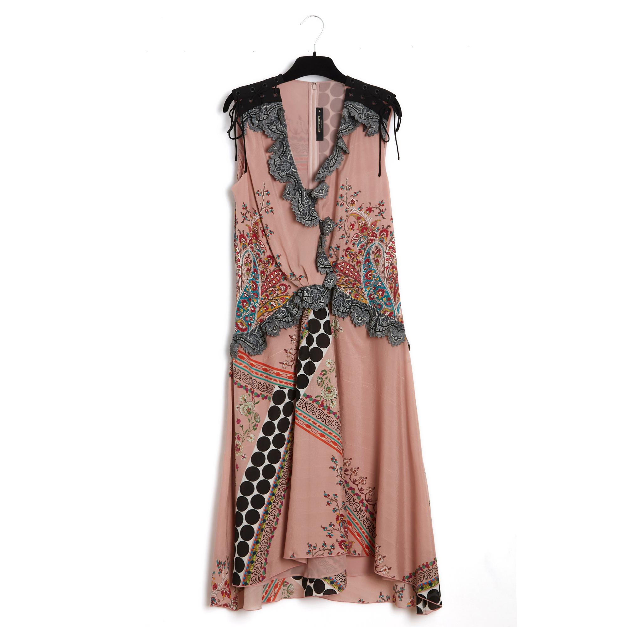 Etro dress in pale pink silk crepe with boteh and floral pattern, laced shoulders, V-neckline edged with a notched crepe ruffle with lace pattern, slightly flared skirt with asymmetrical length, matching crepe lining, fastening with a long zip and
