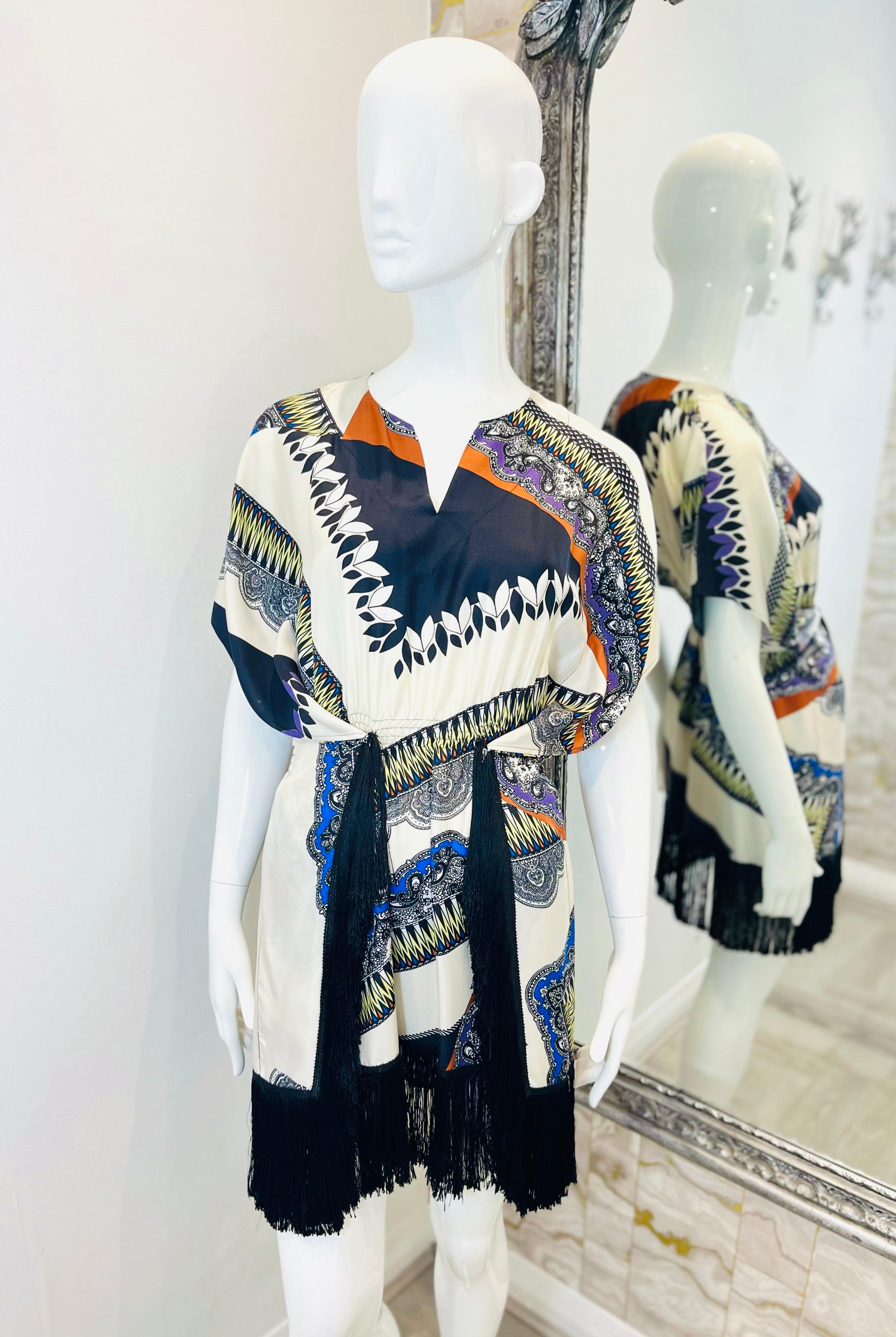 Etro Printed Silk Dress With Fringe Trim

Blue and white dress designed with Paisley and geometric prints with orange and purple accents.

Featuring flattering silhouette with wide kimono-style sleeves and above-the-knee skirt styled with wrap