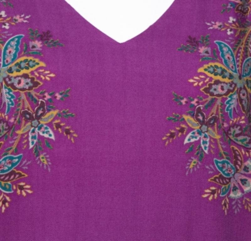 This dress is an example of Etro's unique aesthetics put together with brilliant tailoring. The shift dress has a purple shade along with a beautiful floral print all over.  It is tailored from wool with three-quarter sleeves and a V-neckline. It is
