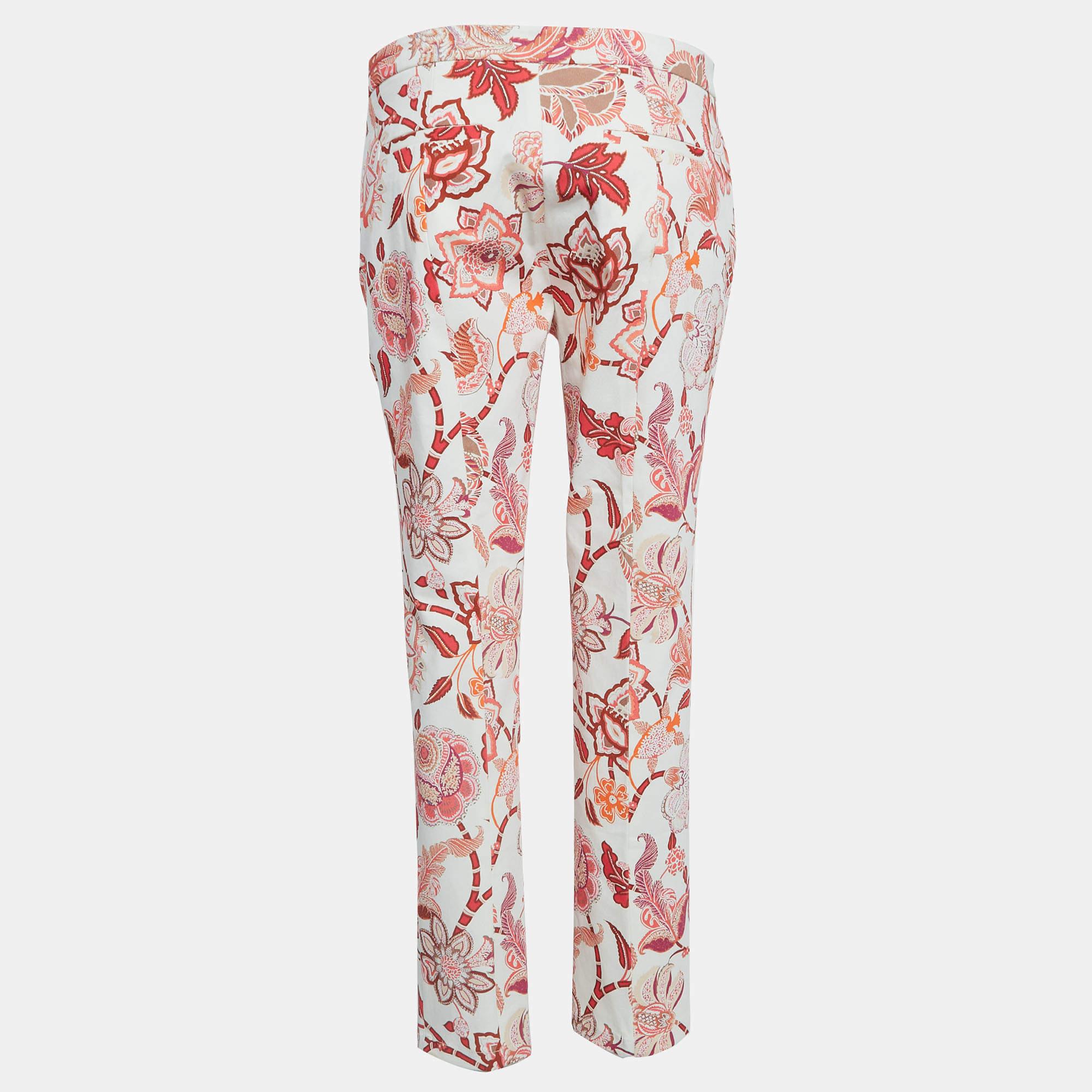 Etros multicolor cotton trousers exude a vibrant charm. Crafted from high quality cotton these trousers boast a playful floral pattern blending elegance with comfort. Perfect for adding a pop of color and style to any ensemble theyre a must have for