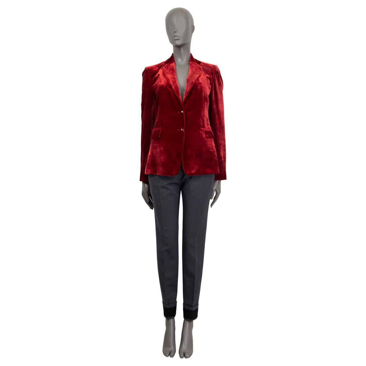 100% authentic Etro soft velvet blazer in red viscose (82%) and silk (18%). Features two sewn shut flap pockets on the front and one chest pocket. Has buttoned cuffs and a slit on the back. Opens with two buttons on the front. Lined in multicolored