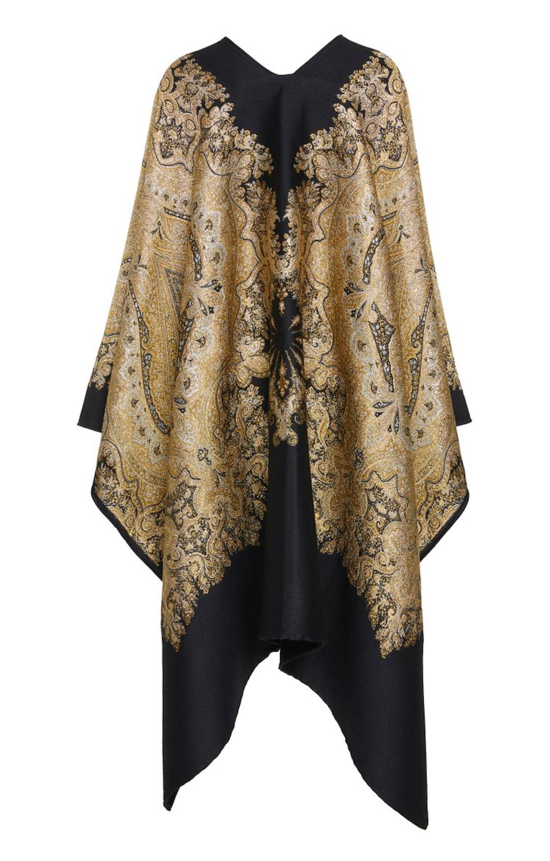 This Etro Fall 2019 Runway open-front cape / poncho features an oversized silhouette and a metallic black and gold jacquard tapestry of beautifully intricate embroidery. Pair this with an all-black outfit for an elegant look or try with denim to