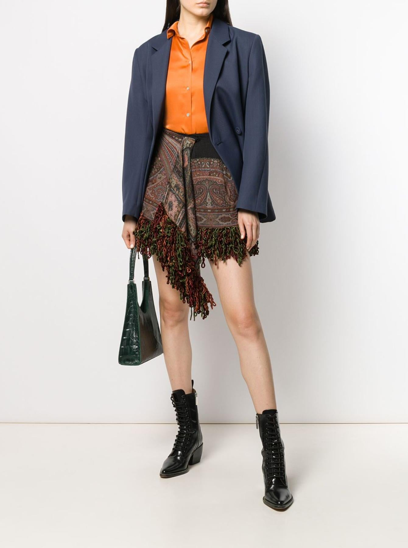 The Etro Fall 2019 Runway draped mini skirt features tassel detailing, an asymmetric hem, and a warm bohemian print. Brand new with tags. Made in Italy.

Size: 42 (IT)

Measurements (taken from a size 40): 
Length: 16 in
Total Length (waist to