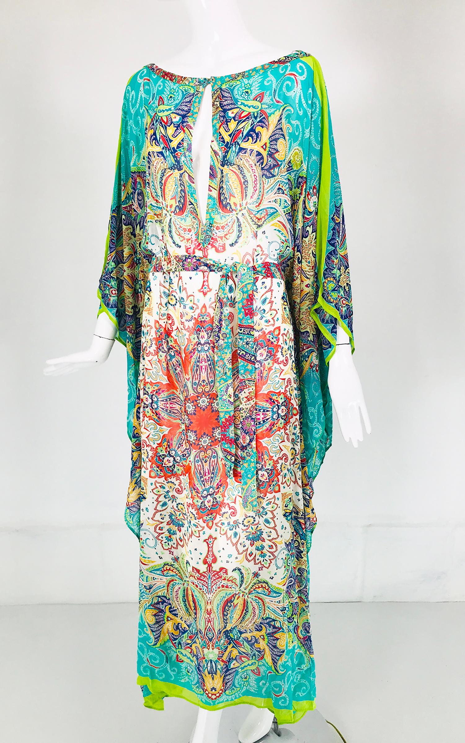 Etro signature turquoise paisley silk chiffon caftan. Beautiful paisley design in vibrant 
 In excellent wearable condition. Pull on with a deep center front vent there is a button at the neck top. Full & floating this caftan has openings at the
