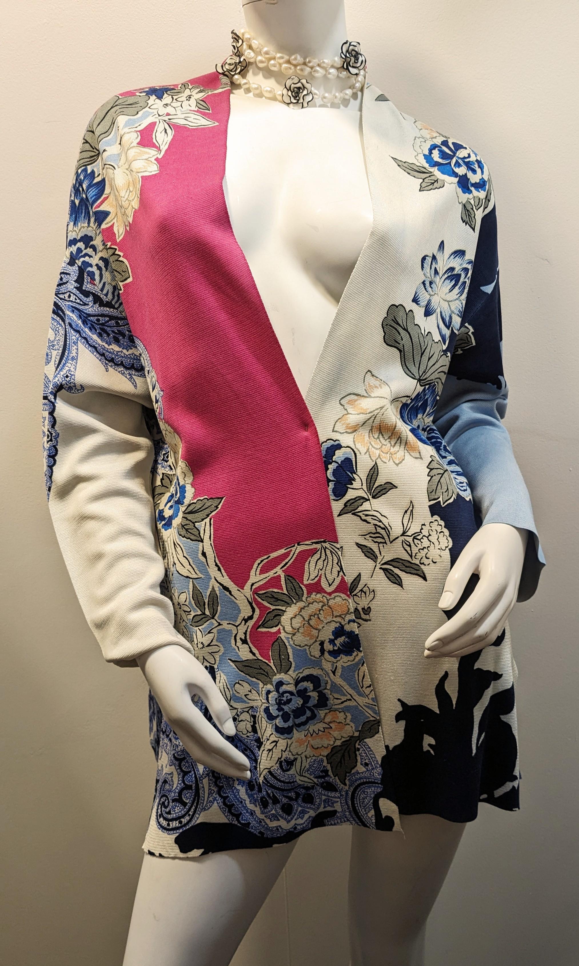 ETRO  Silk Cardigan with Floral Motifs
Silk cardigan in blue and pink tones with front and side openings
Size  44
Length 75 cm
Since its creation in 1968, Etro has managed to keep the fashion world on edge with its now inseparable paisley prints.