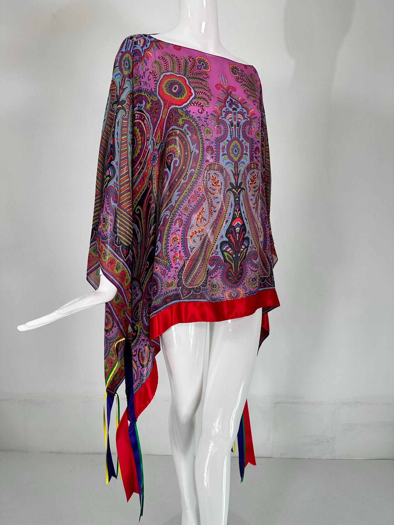 Etro silk paisley ribbon trimmed chiffon poncho. Beautiful bright silk paisley pull on poncho is trimmed in red, yellow & purple silk ribbons. Sheer silk chiffon poncho, made from a large Etro scarf/shawl with a finished neck opening and applied