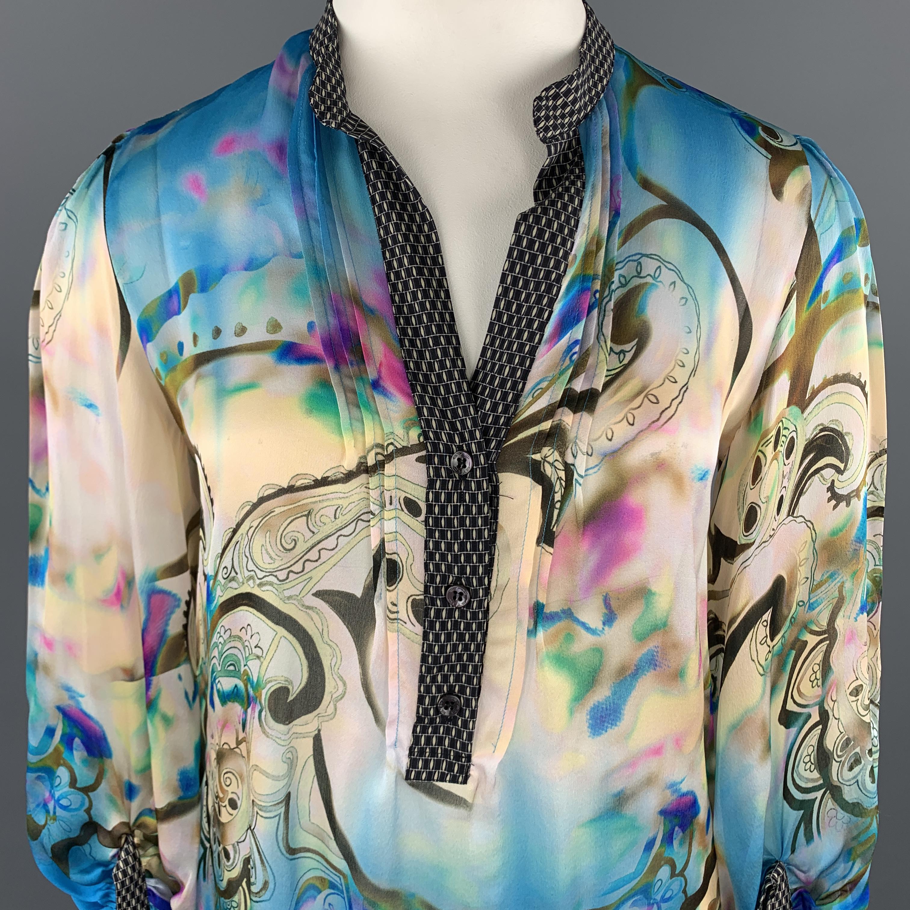 ETRO blouse comes in watercolor print silk chiffon with paisley a motif, printed band collar, and gathered sleeves. Made in Italy.

Excellent Pre-Owned Condition.
Marked: IT 48

Measurements:

Shoulder: 16 in.
Bust: 40 in.
Sleeve: 19 in.
Length: 29