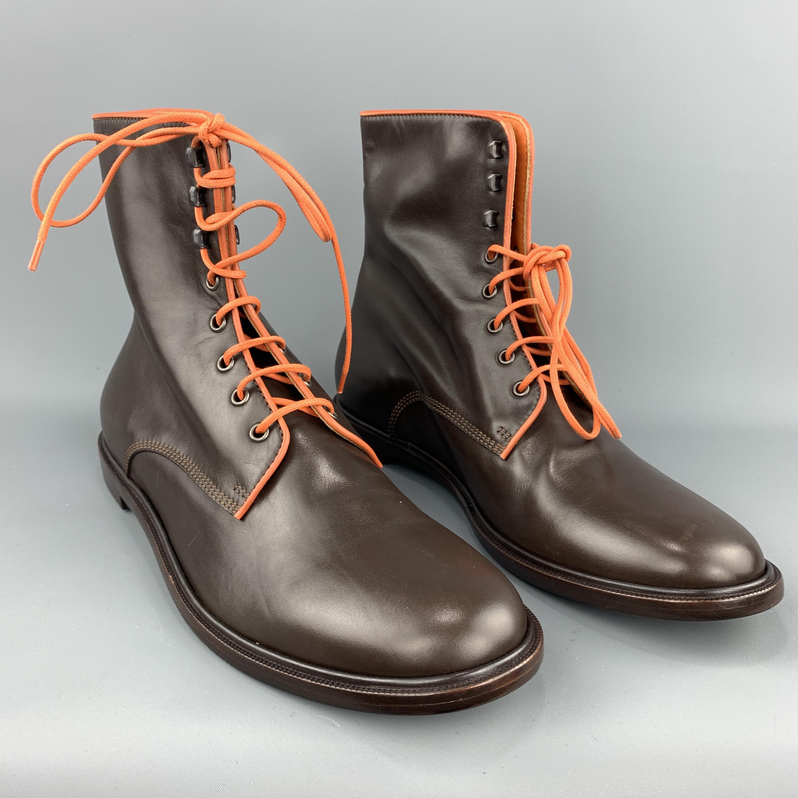 ETRO boots come in smooth brown leather with orange piping and laces. New with Box. Made in Italy.
 
Brand New.
Marked: IT 45
 
Outsole: 12.75 x 4.5 in.
Height: 7.5 in.