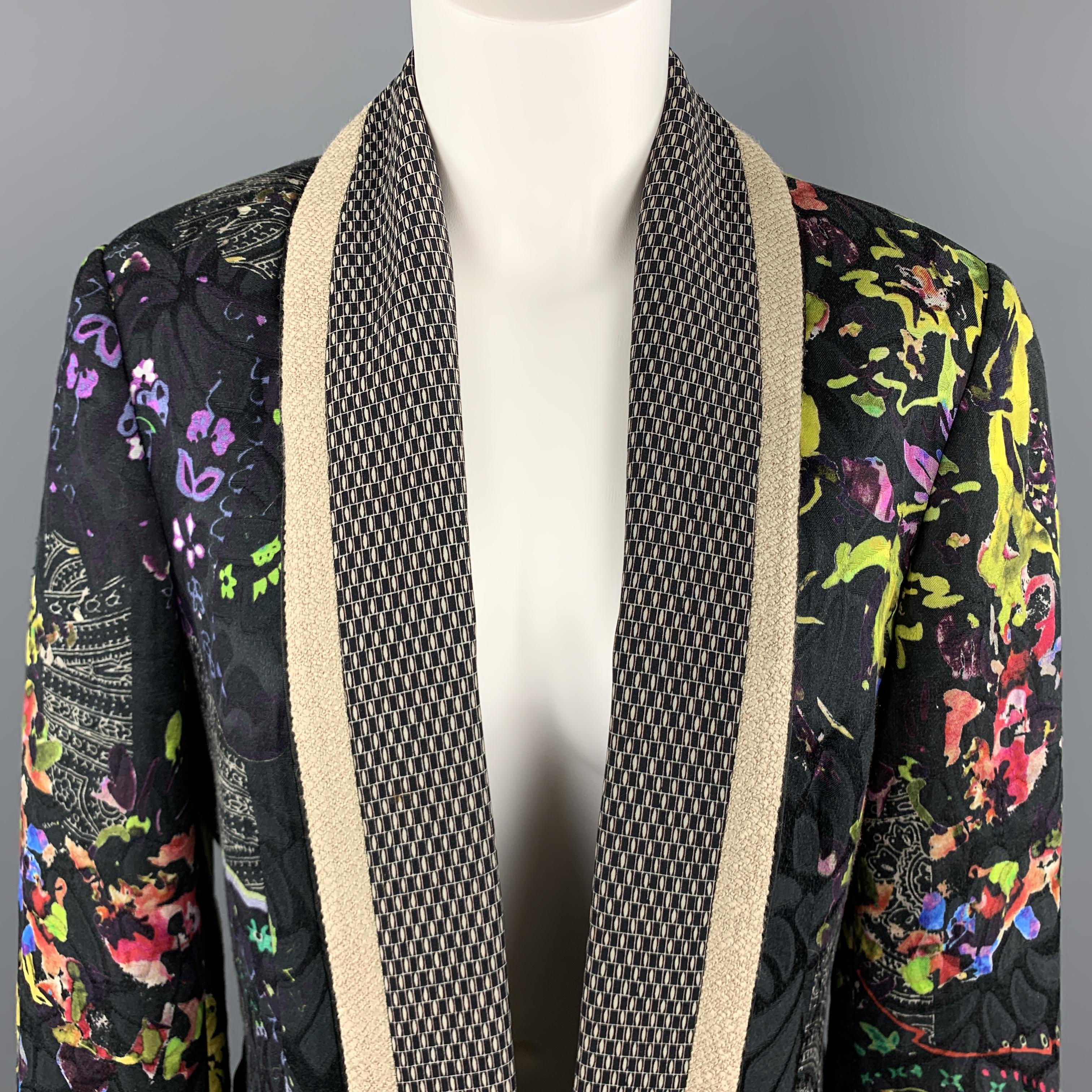 ETRO jacket comes in black and multi-color floral and paisley print with an open front, and woven trimmed shawl collar. Made in Italy.

Excellent Pre-Owned Condition.
Marked: IT 48

Measurements:

Shoulder: 16 in.
Bust: 42 in.
Sleeve: 23 in.
Length: