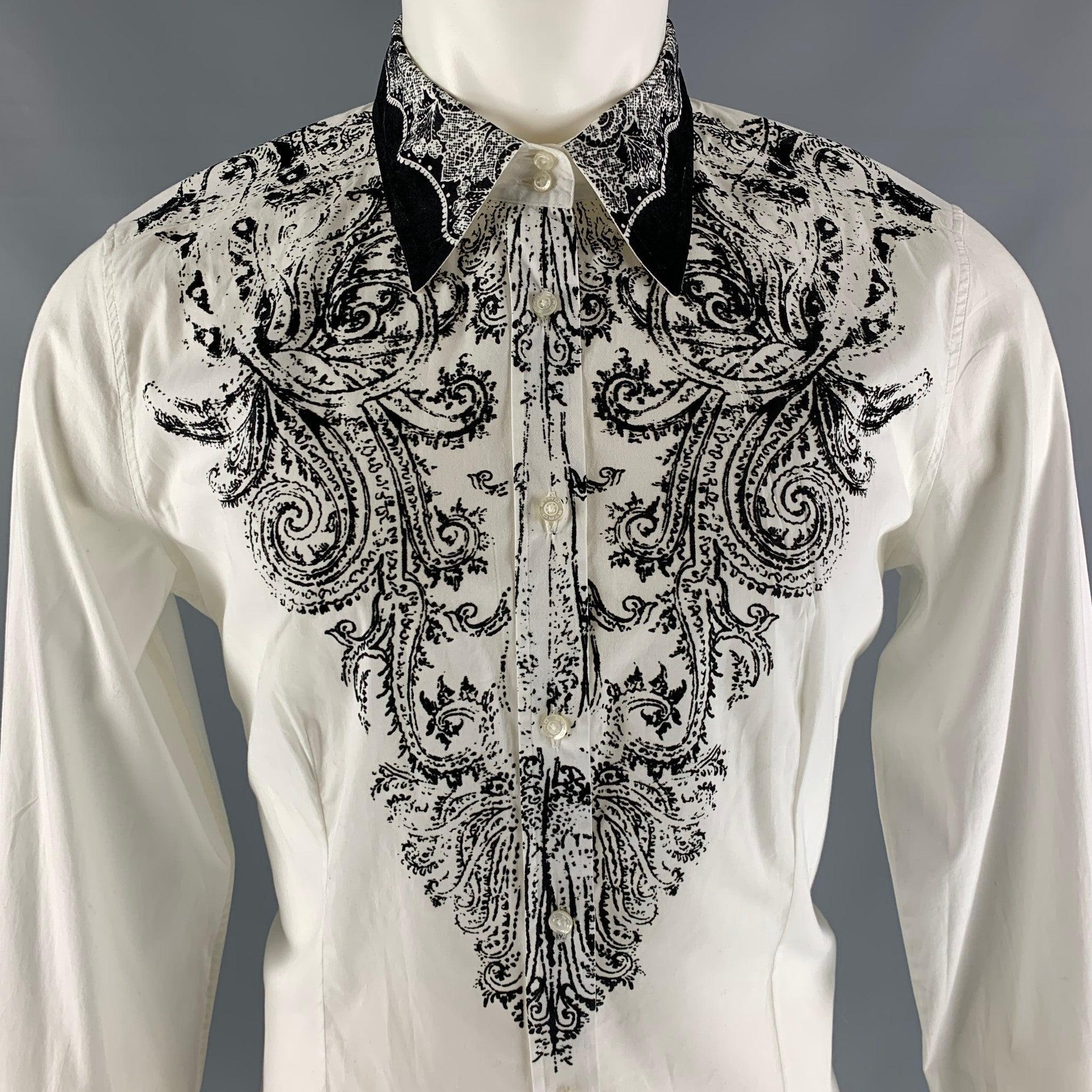 ETRO long sleeve shirt comes in a white cotton and elastane featuring a velvet applique at front and cuff, button up closure , two button angle cuff, and a straight collar. Made in Italy.Excellent Pre-Owned Condition. 

Marked:   50 

Measurements: