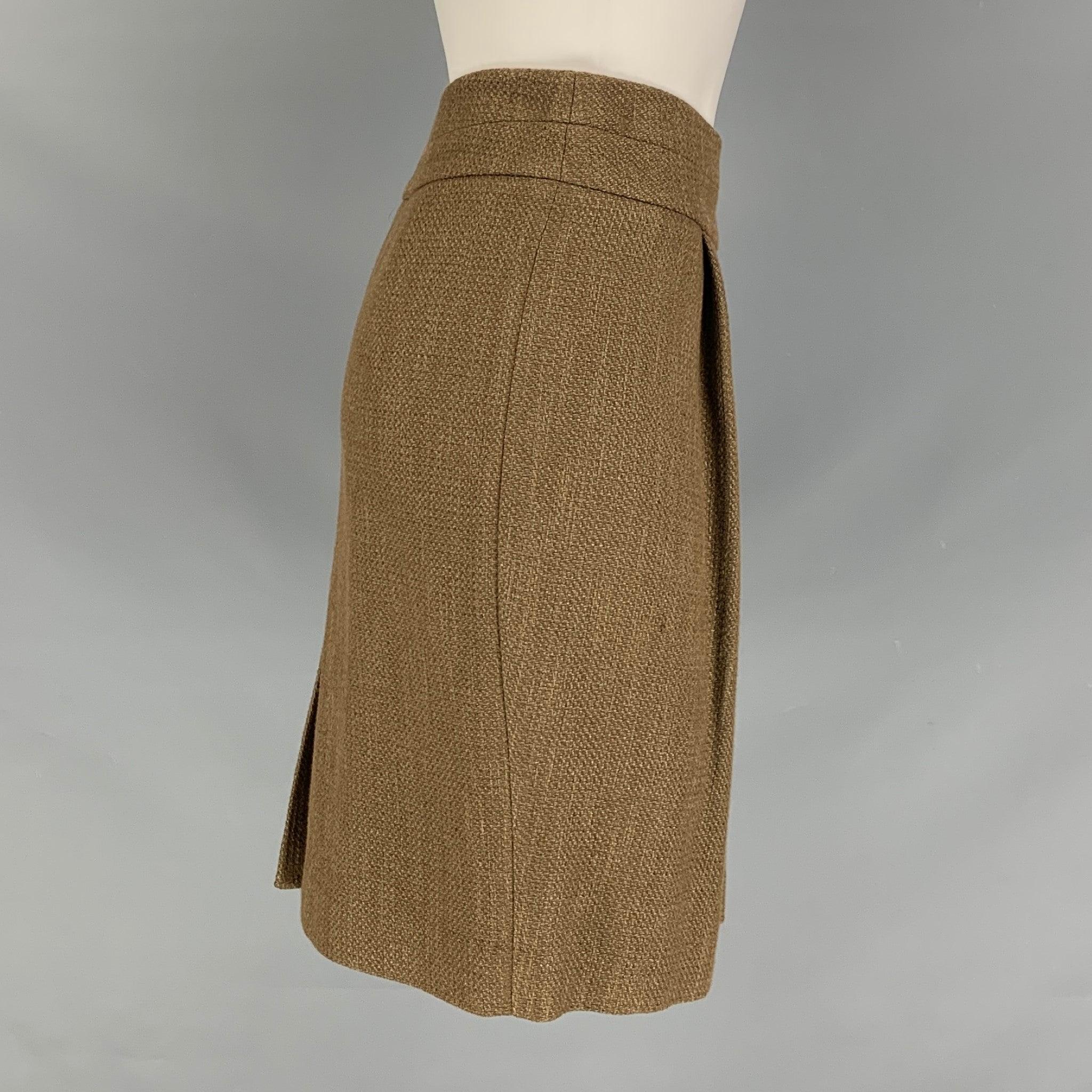 ETRO wide waistband short skirt comes in an olive wool blend featuring pleated detail at front and zip closure at center back. Made in Italy.Excellent Pre-Owned Condition.  

Marked:   38 IT 

Measurements: 
  Waist: 28 inches Hip:
33 inches Length: