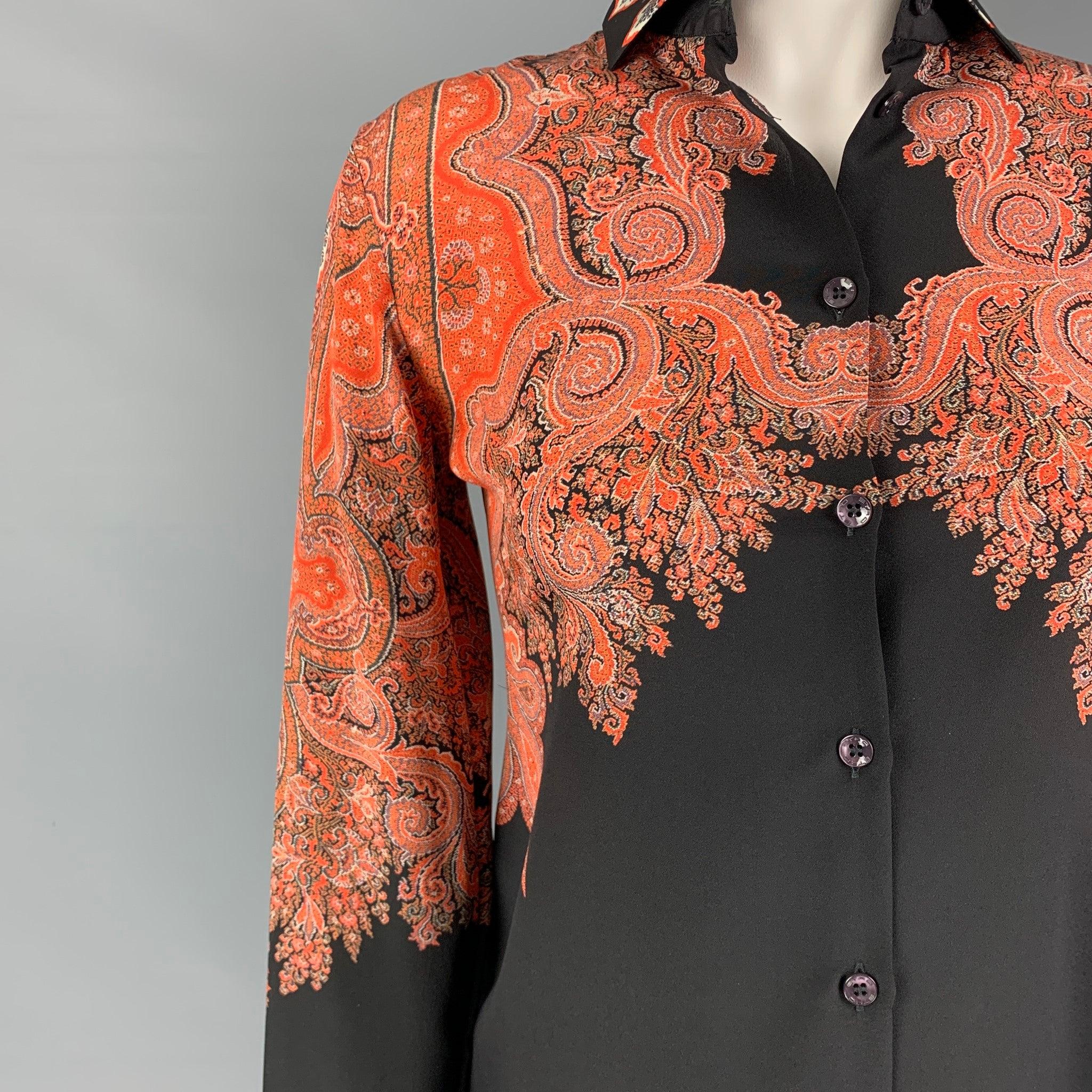 ETRO top comes in a orange & black paisley silk featuring a spread collar and a buttoned closure. Made in Italy.
Excellent
Pre-Owned Condition. 

Marked:   38 

Measurements: 
 
Shoulder: 15.5 inches Bust: 34 inches Sleeve: 23 inches Length: 27