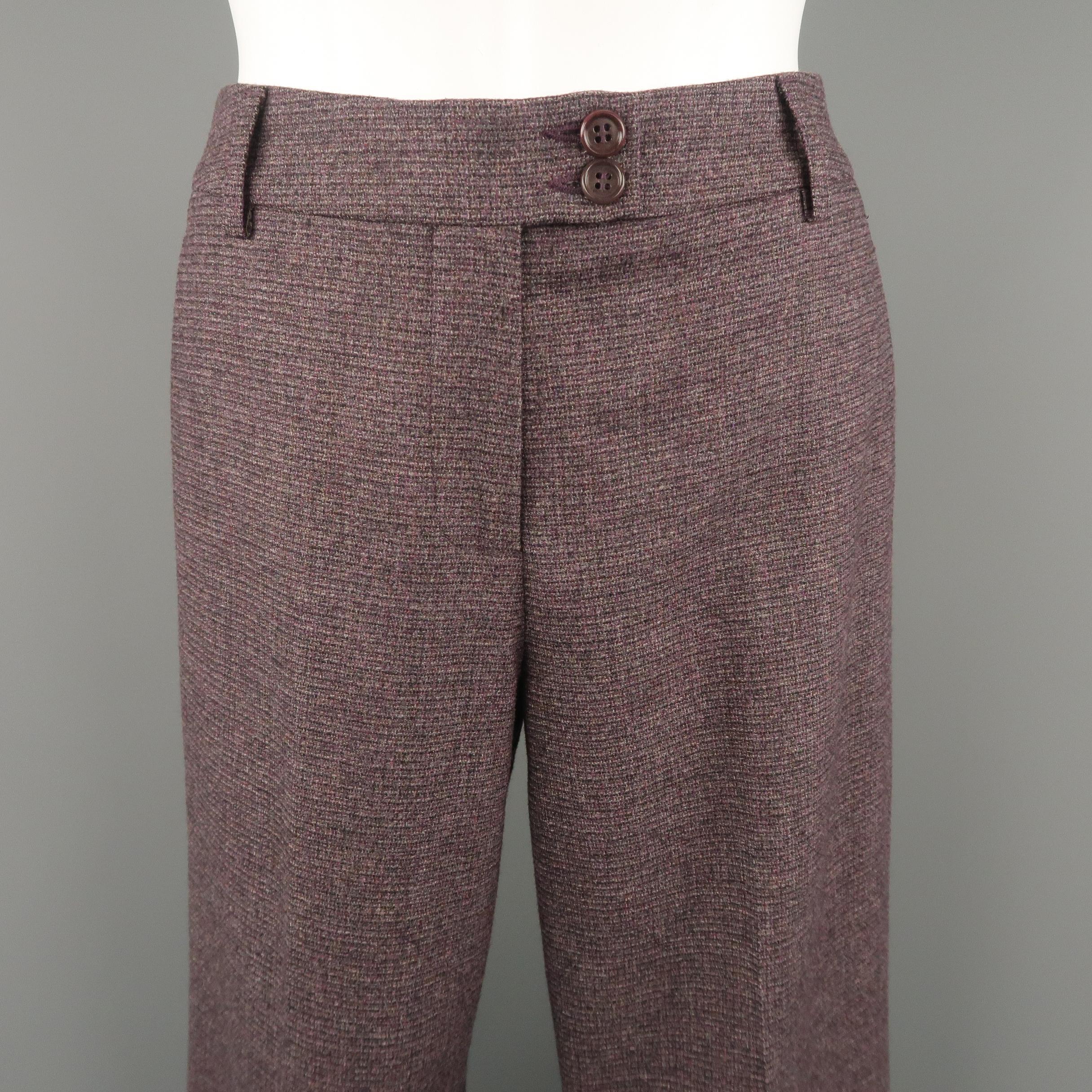 ETRO dress pants come in purple stretch wool tweed with a tab button waistband and flat front straight leg. Made in Italy.
 
Excellent Pre-Owned Condition.
Marked: IT 38
 
Measurements:
 
Waist: 30 in.
Rise: 10 in.
Inseam: 32 in.
