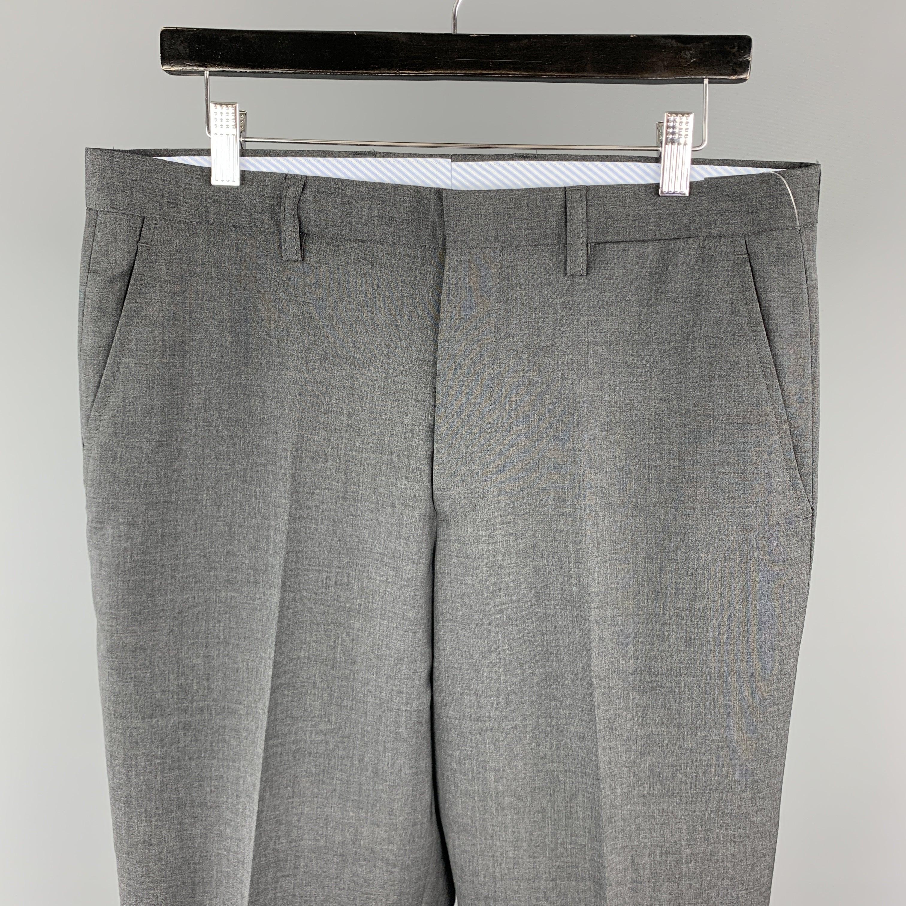 ETRO
dress pants comes in a solid dark gray wool material, featuring a flat front style, zip fly, and seam and slit pockets. Made in Italy.Excellent Pre-Owned Condition. 

Marked:   IT 50 

Measurements: 
  Waist: 35 inches 
Rise: 11 inches 
Inseam: