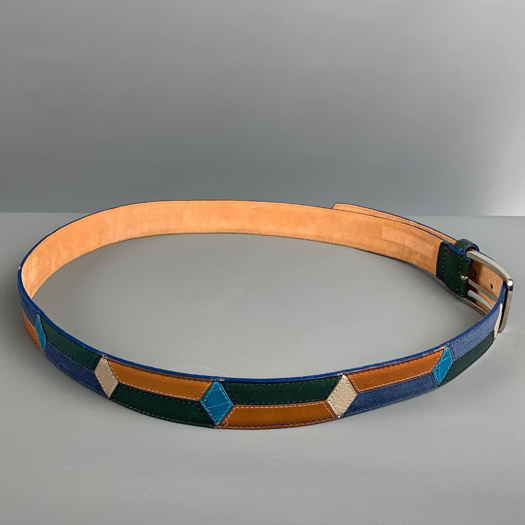 ETRO belt comes in a beige and multi-color leather featuring a silver tone buckle. Made in Italy.Very Good Pre-Owned Condition.
Minor signs of wear. 

Marked:  
44/110Length: 50 inches Width: 1.5 inches Fits: 45 inches  - 42 inches Buckle: 2.5