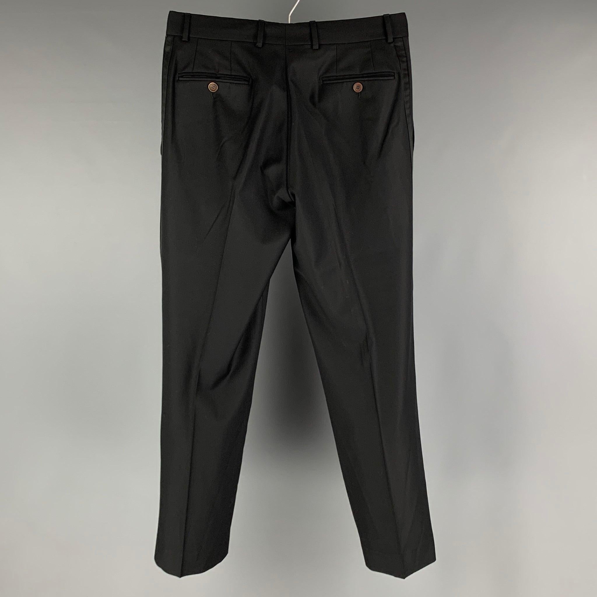ETRO tuxedo dress pants come in a black wool twill woven material with a flat front, regula fit, zipper fly closure.
Excellent Pre-Owned Condition.
 

Marked:  52 

Measurements: 
 Waist: 32 inches Rise: 9.5 inches Inseam: 29 inches 
 
Leg Opening: