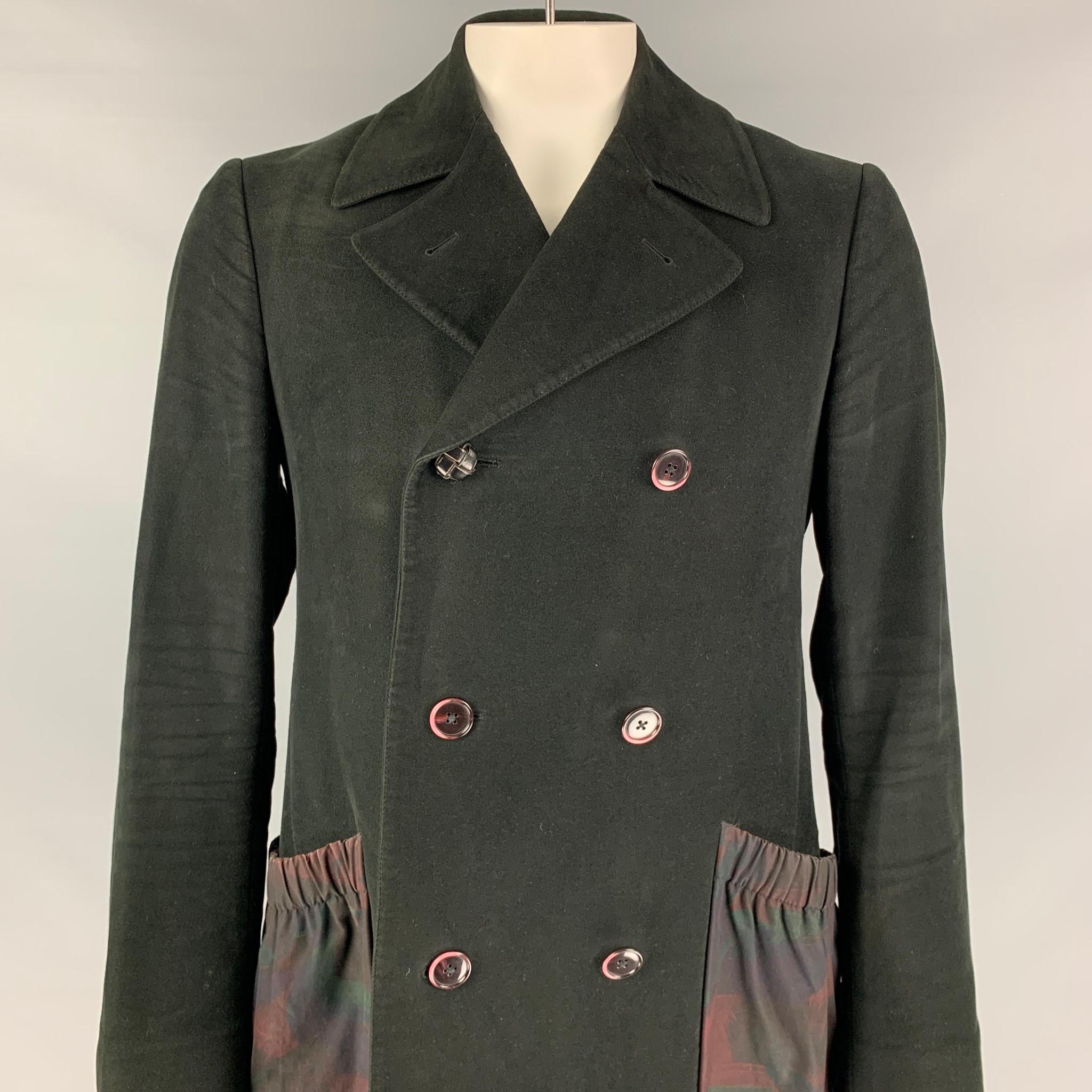 ETRO coat comes in a black textured material with a full liner featuring a notch lapel, elastic patch pockets, oversized fit, single back vent, and a double breasted closure. 

Very Good Pre-Owned Condition. Missing fabric tag.
Marked: