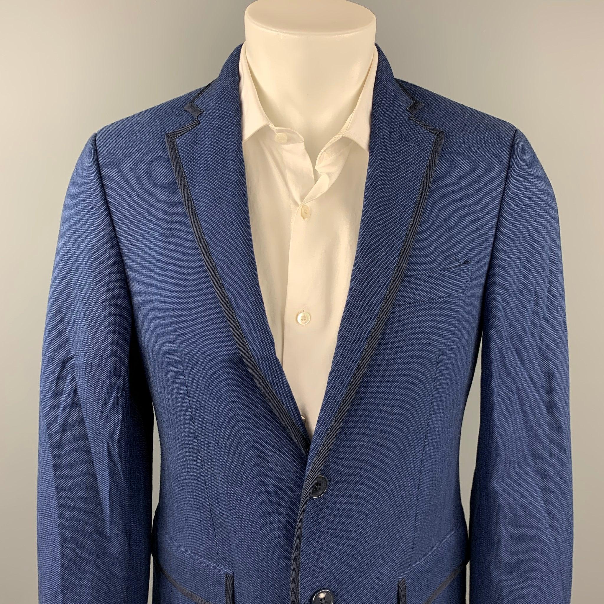 ETRO
sport coat comes in a blue & black nailhead cotton with a full plaid liner featuring a notch lapel, flap pockets, and a two button closure. Made in Italy.Very Good Pre-Owned Condition. 

Marked:   48 

Measurements: 
 
Shoulder: 17.5 inches