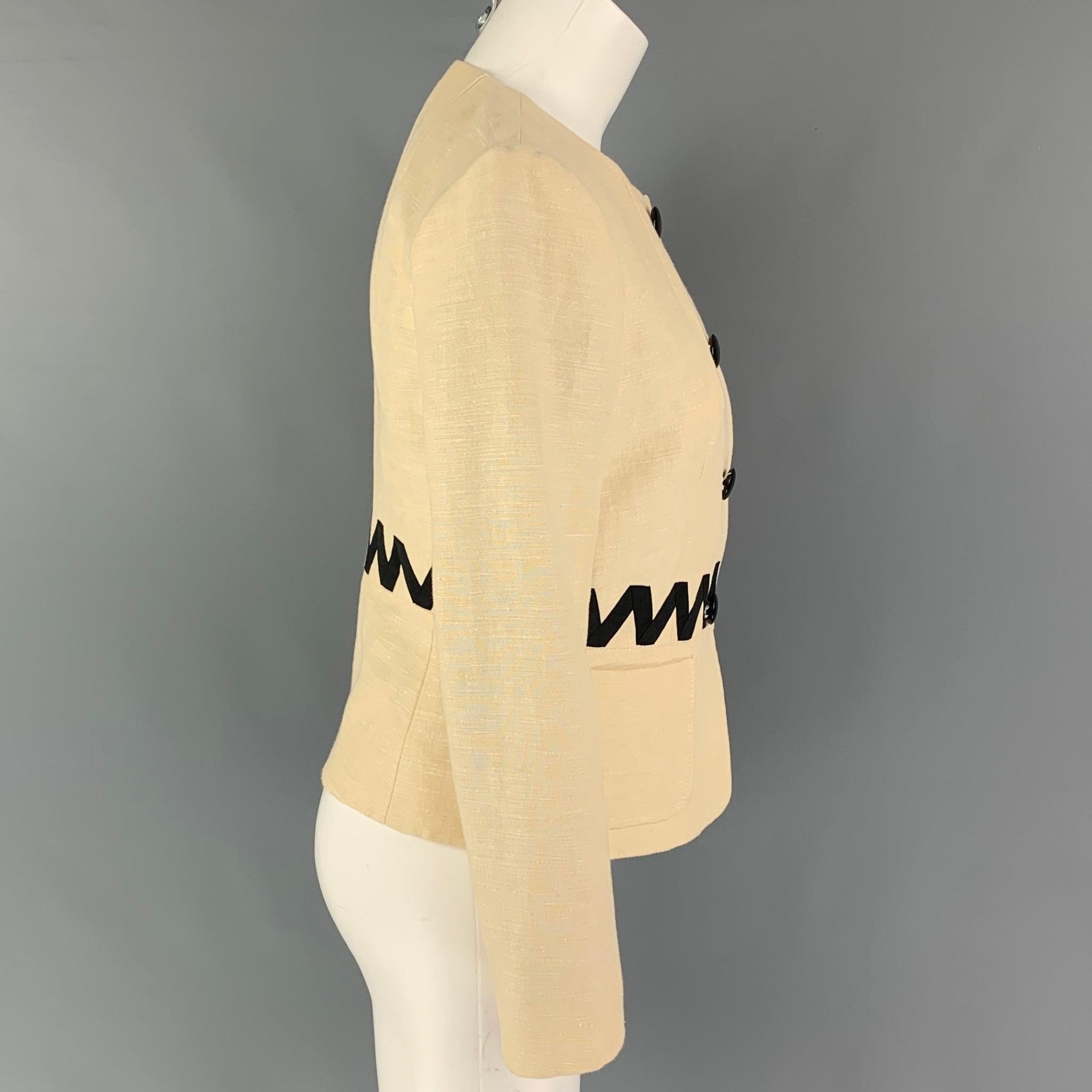 ETRO jacket comes in a cream & black silk blend with a full liner featuring a collarless style, patch pockets, ribbon trim, and a buttoned closure. Made in Italy.Very Good
Pre-Owned Condition. 

Marked:   40 

Measurements: 
 
Shoulder: 15 inches 