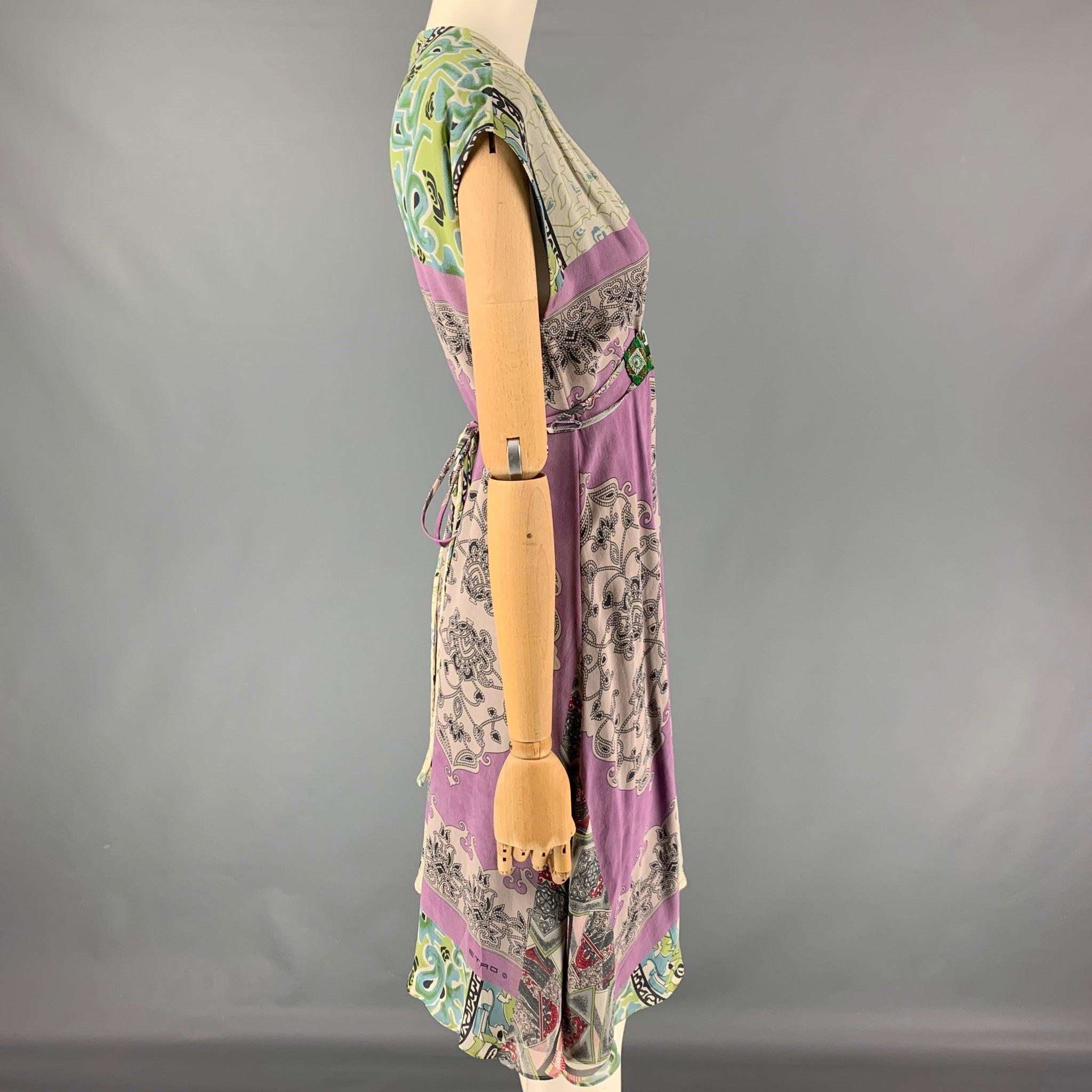 ETRO dress comes in a green & purple abstract print silk featuring a sleeveless style, front embroidered design, and a belted closure. Made in Italy. Very Good
 Pre-Owned Condition. 
 

 Marked:  40 
 

 Measurements: 
  
 Shoulder: 17.5 inches