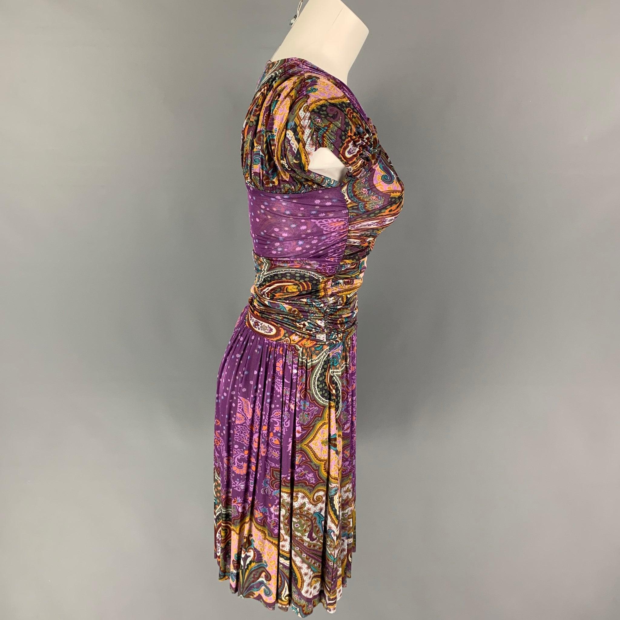 ETRO dress comes in a purple multi-color paisley viscose featuring a ruched bodice and pleated skirt. Made in Italy.
New With Tags.
 

Marked:   40 

Measurements: 
 
Shoulder: 16.5 inches  Bust: 26 inches  Waist: 22 inches  Hip: 30 inches  Length:
