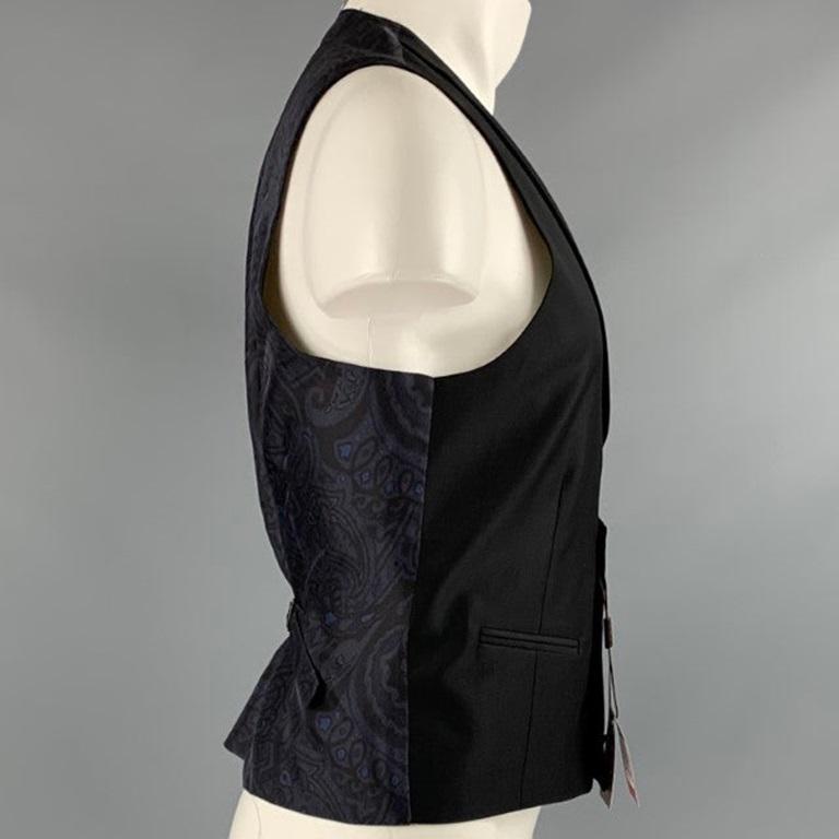 ETRO vest
in a
black wool fabric featuring shawl collar, silk paisley patterned back, and a double breasted button closure. Made in Italy.New with Tags. 

Marked:   50 

Measurements: 
 
Shoulder: 13 inches Chest: 40 inches Length: 23 inches 
  
  
