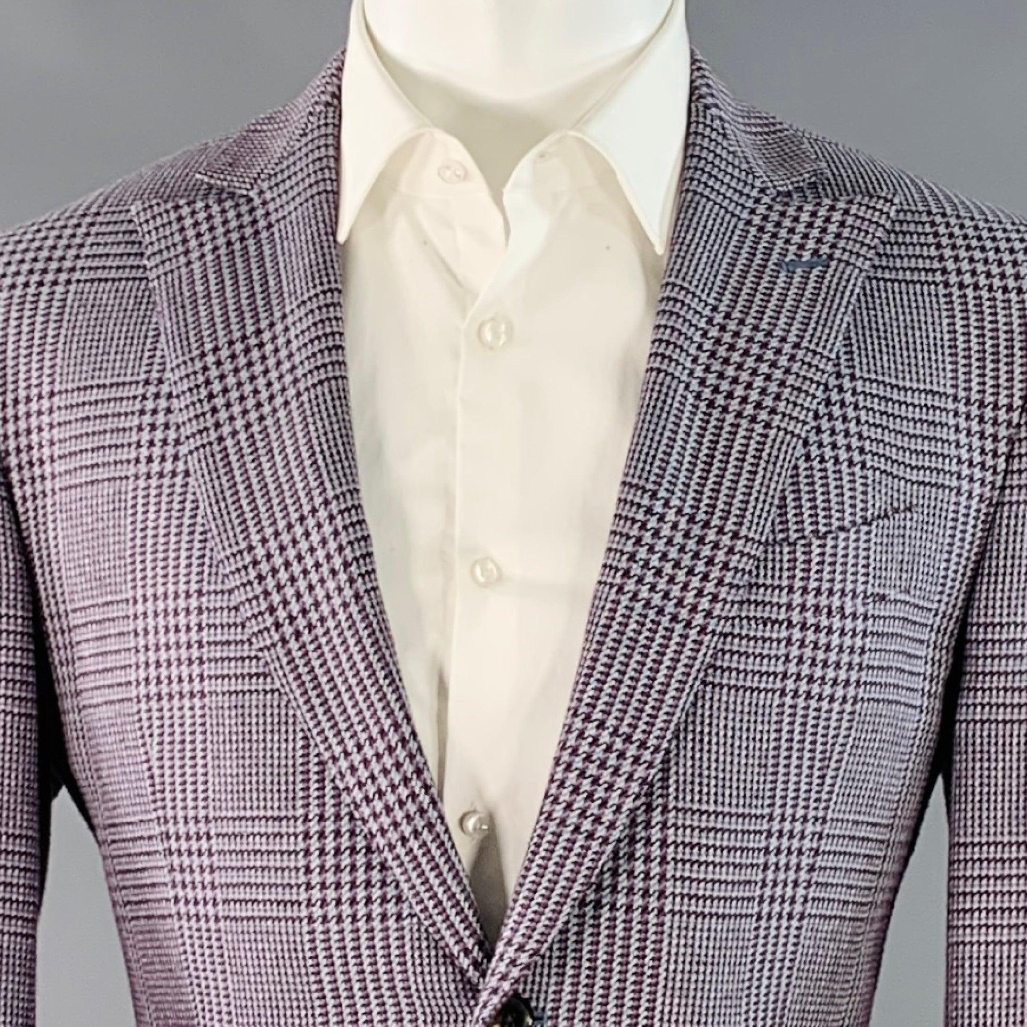 ETRO sport coat
in a grey and burgundy silk cotton woven fabric featuring a glenplaid pattern, peak lapel, double vented back, and double button closure. Made in Italy.Very Good Pre-Owned Condition. Minor mark at cuff. 

Marked:   IT 50