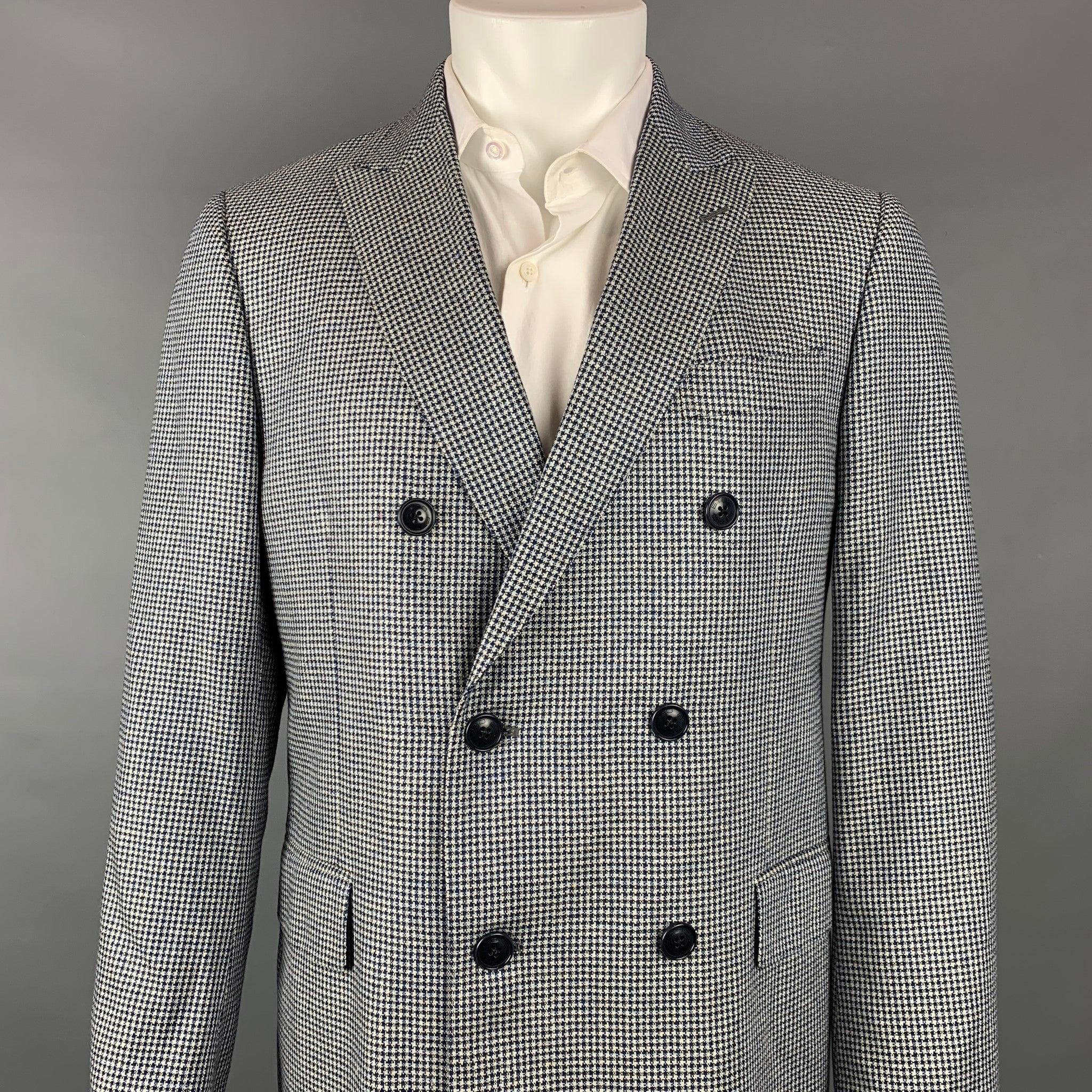 ETRO sport coat comes in a navy & white houndstooth silk with a full liner featuring a peak lapel, flap pockets, and a double breasted closure. Made in Italy.Very Good
 Pre-Owned Condition. 
 

 Marked:  IT 50 
 

 Measurements: 
  
 Shoulder: 17.5
