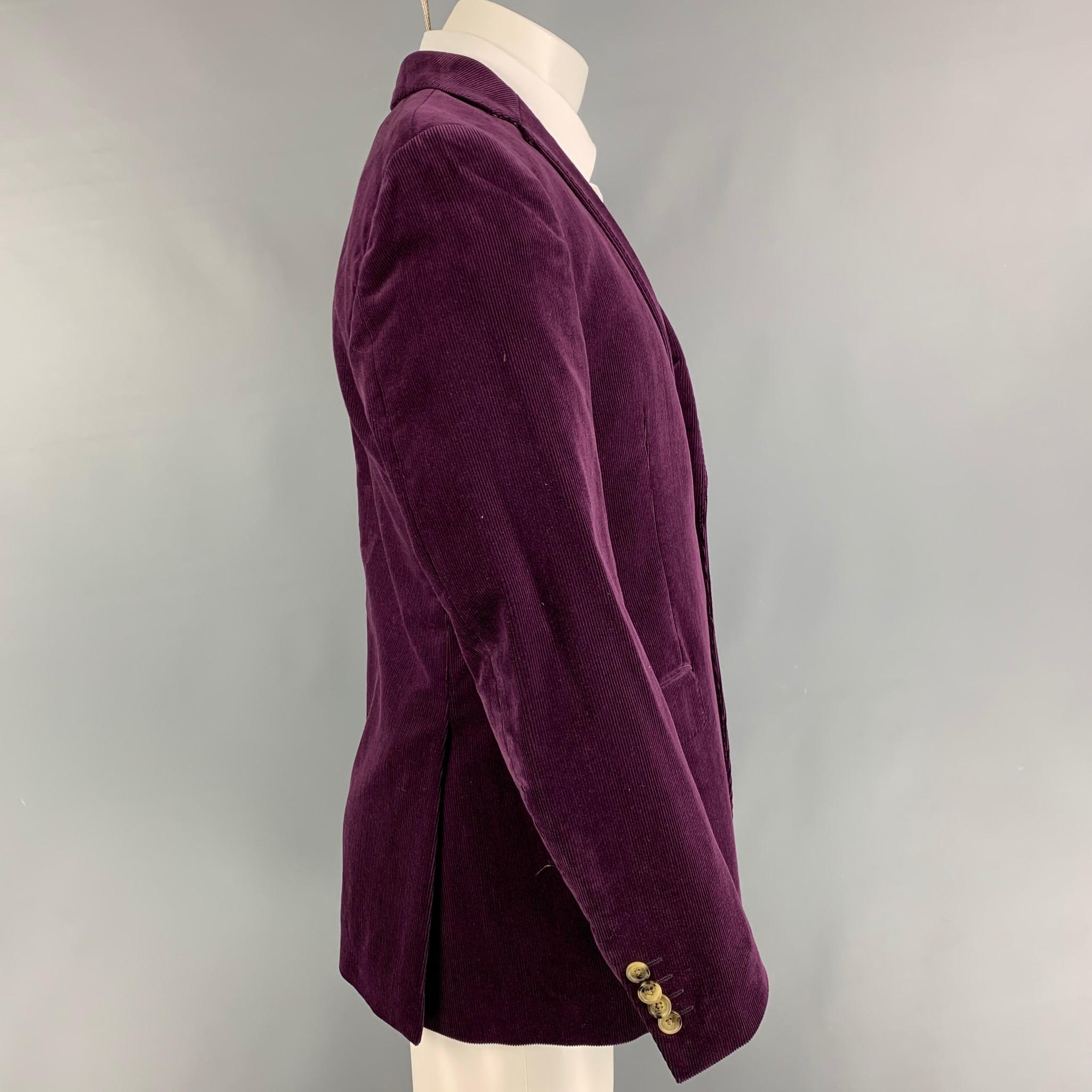ETRO sport coat comes in a purple corduroy cotton with a full liner featuring a notch lapel, flap pockets, double back vent, and a double button closure. Made in Italy. 

Very Good Pre-Owned Condition.
Marked: 50

Measurements:

Shoulder: 18