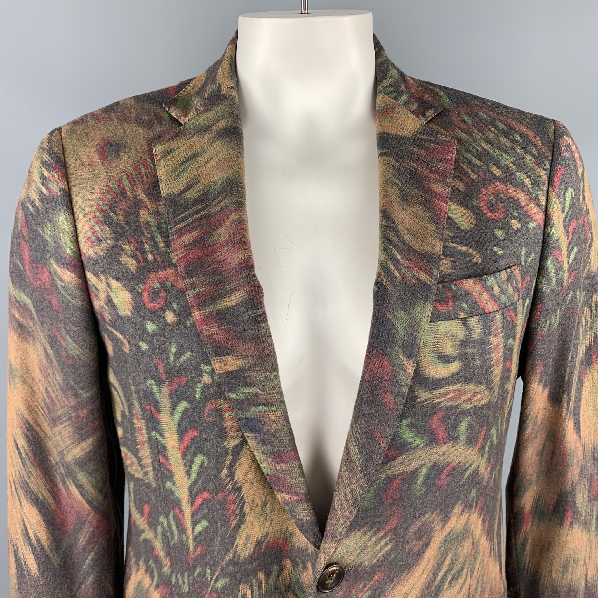 ETRO sport coat comes in an abstract beige and multi color abstract paisley print wool blend with a notch lapel, single breasted, two button front, and printed silk liner. Made in Italy.

Excellent Pre-Owned Condition.
Marked: IT