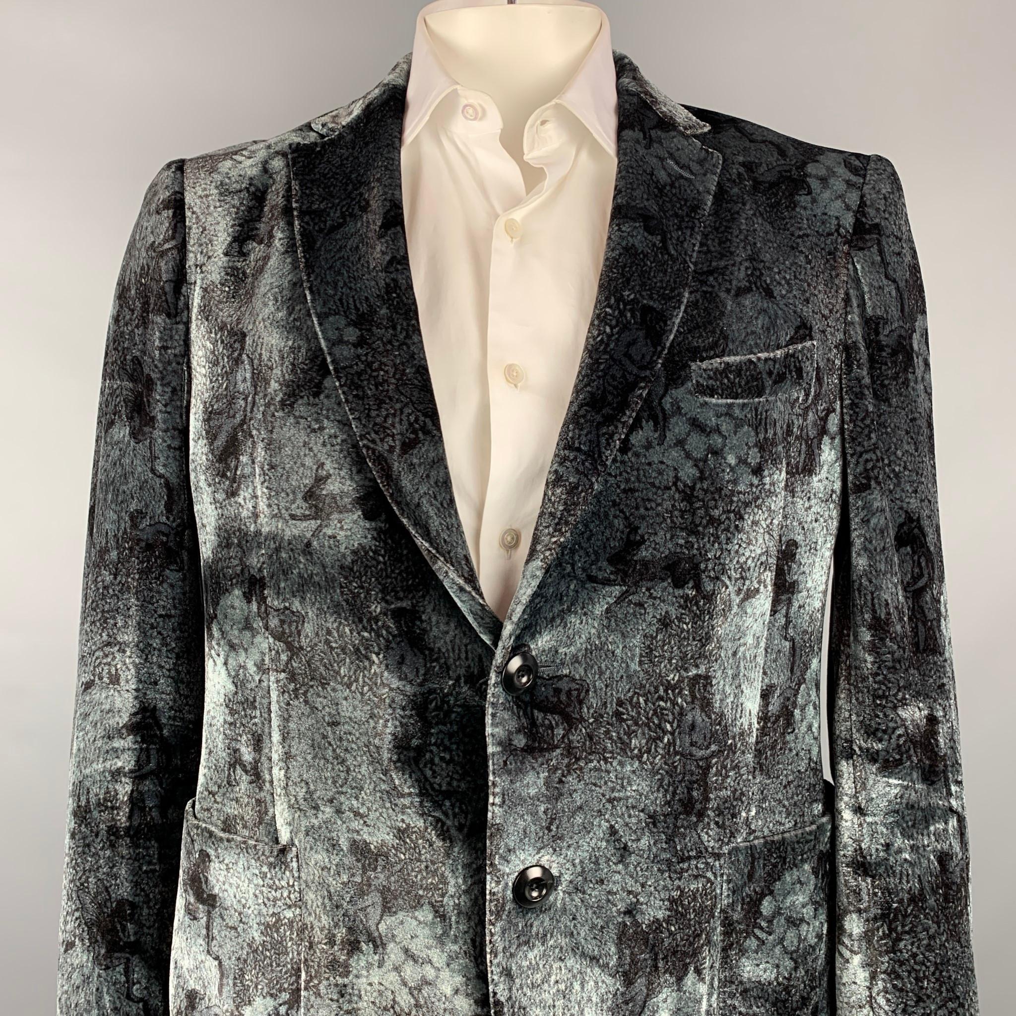 ETRO sport coat comes in a black & grey print viscose / silk with a half liner featuring a notch lapel, patch pockets, and a two button closure. Made in Italy.

Very Good Pre-Owned Condition.
Marked: IT 54

Measurements:

Shoulder: 18.5 in. 
Chest: