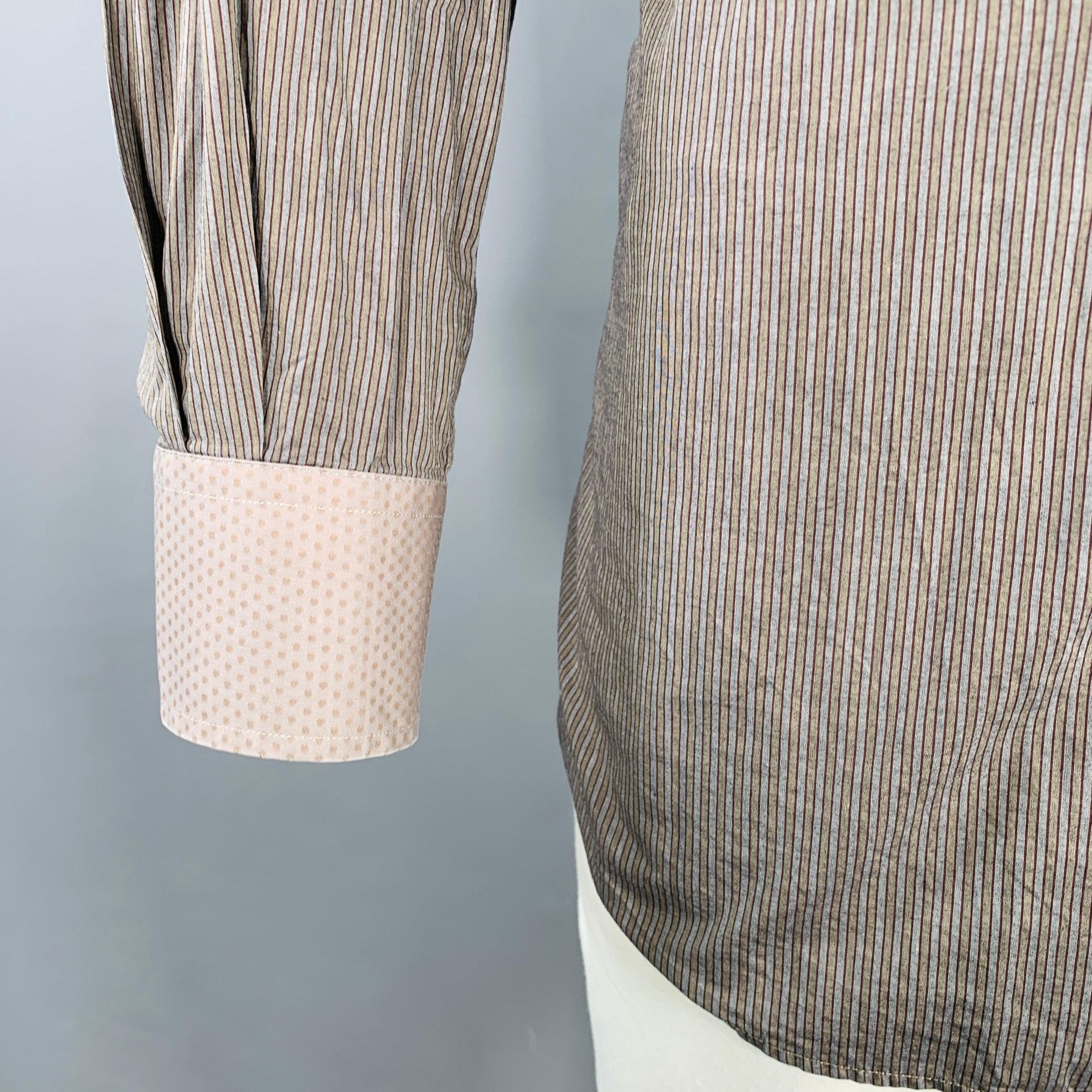 ETRO long sleeve shirt
in a charcoal grey cotton woven fabric featuring a stripe pattern, curved cutaway collar, and button closure. Made in Italy.Excellent Pre-Owned Condition. 

Marked:   44 

Measurements: 
 
Shoulder: 19.5 inches Chest: 48