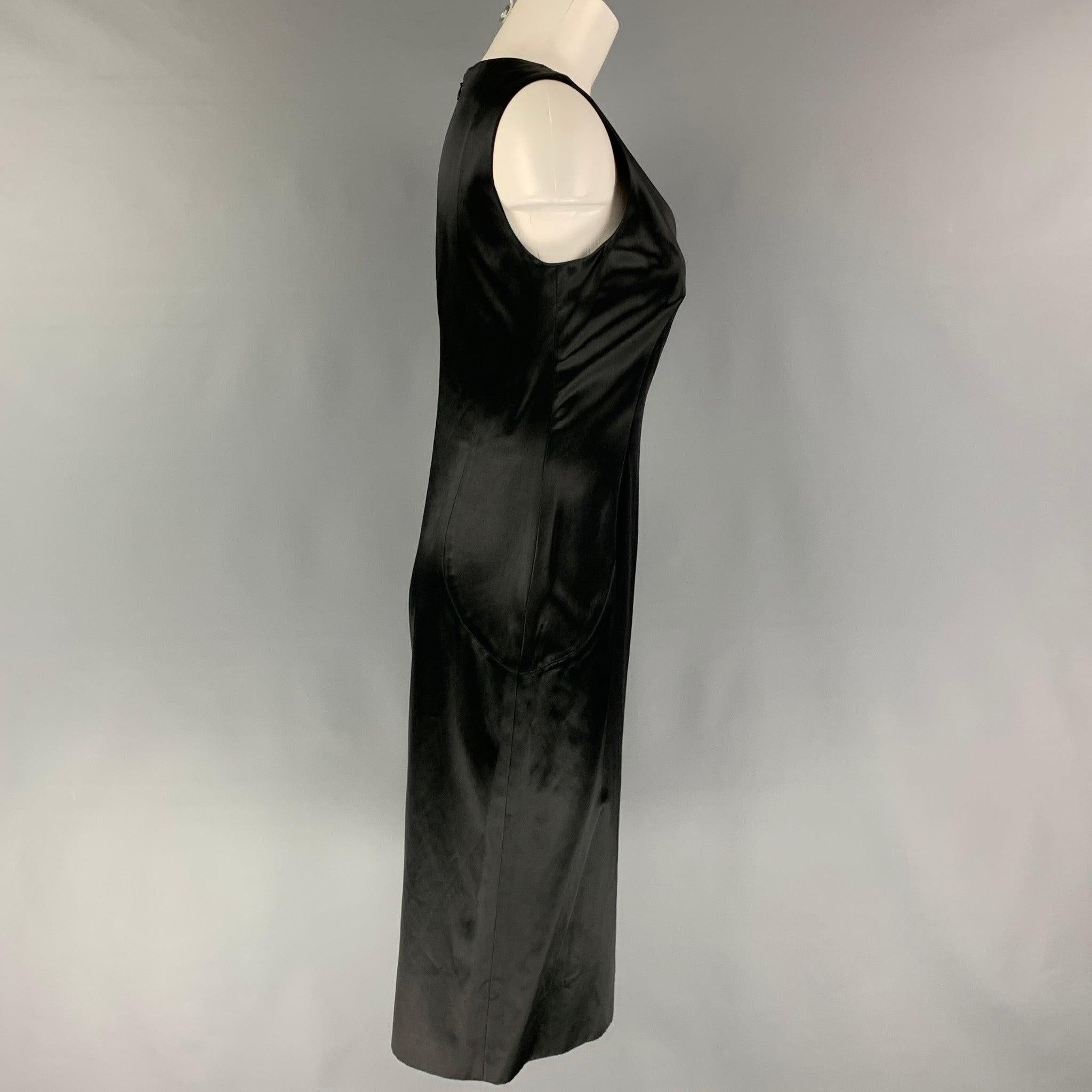 ETRO cocktail dress comes in a black satin cotton blend featuring a v-neck, sleeveless, a-line, back slit, and a back zip up closure. Made in Italy.
Very Good
Pre-Owned Condition. 

Marked:   42 

Measurements: 
 
Shoulder: 14.5 inches  Bust: 32