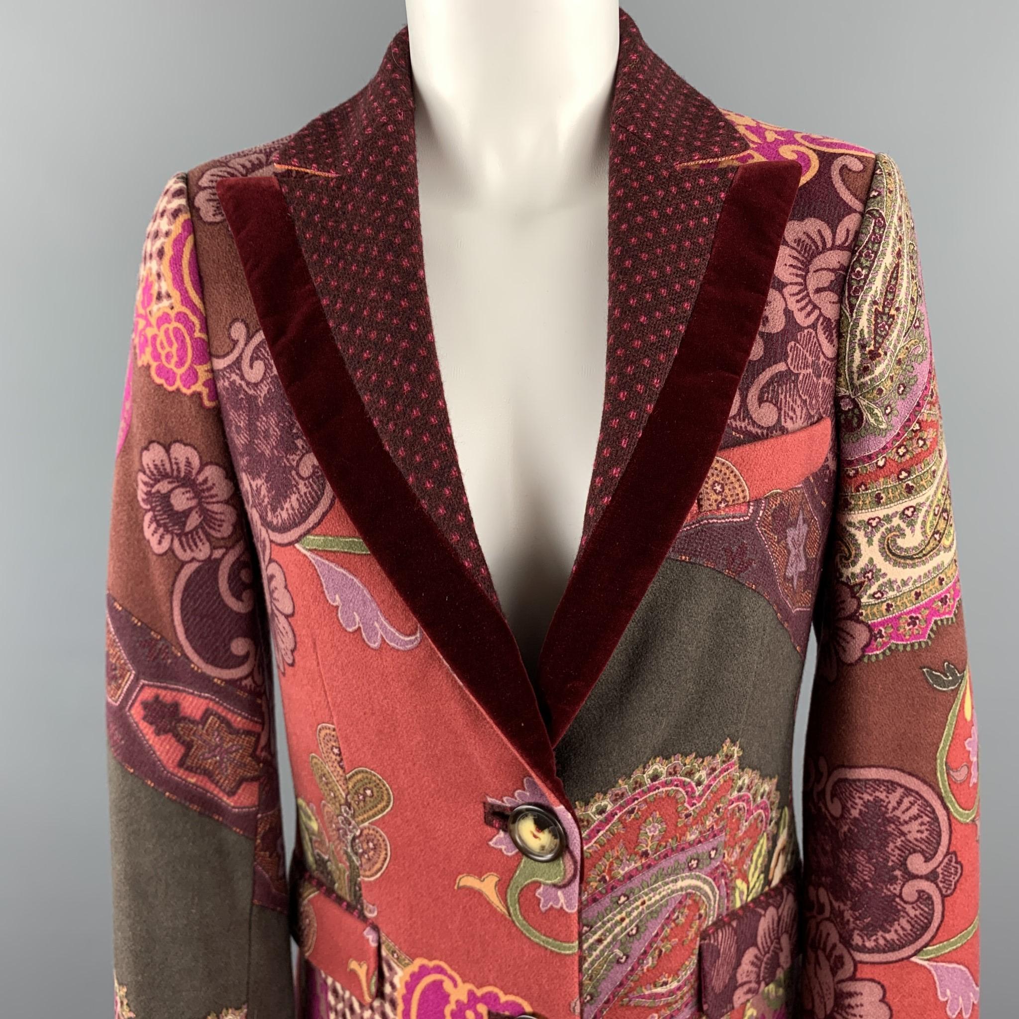 ETRO coat comes in light burgundy paisley print wool blend flannel with a velvet trimmed peak lapel, and two button front. Made in Italy.

Excellent Pre-Owned Condition.
Marked: IT 42

Measurements:

Shoulder: 15 in.
Bust: 38 in.
Waist: 34 in.
Hip: