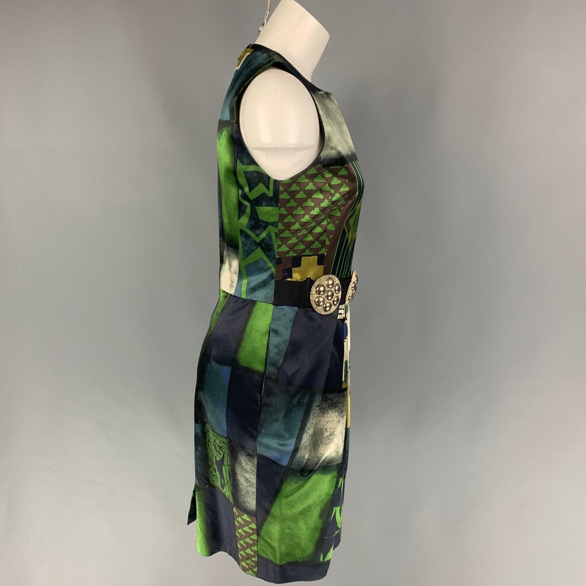 ETRO dress comes in a green & black abstract cotton / viscose featuring a sheath style, sleeveless, studded ribbon detail, slit pockets, and a back zip up closure. Made in Italy.
Very Good
Pre-Owned Condition. 

Marked:   42 

Measurements: 
