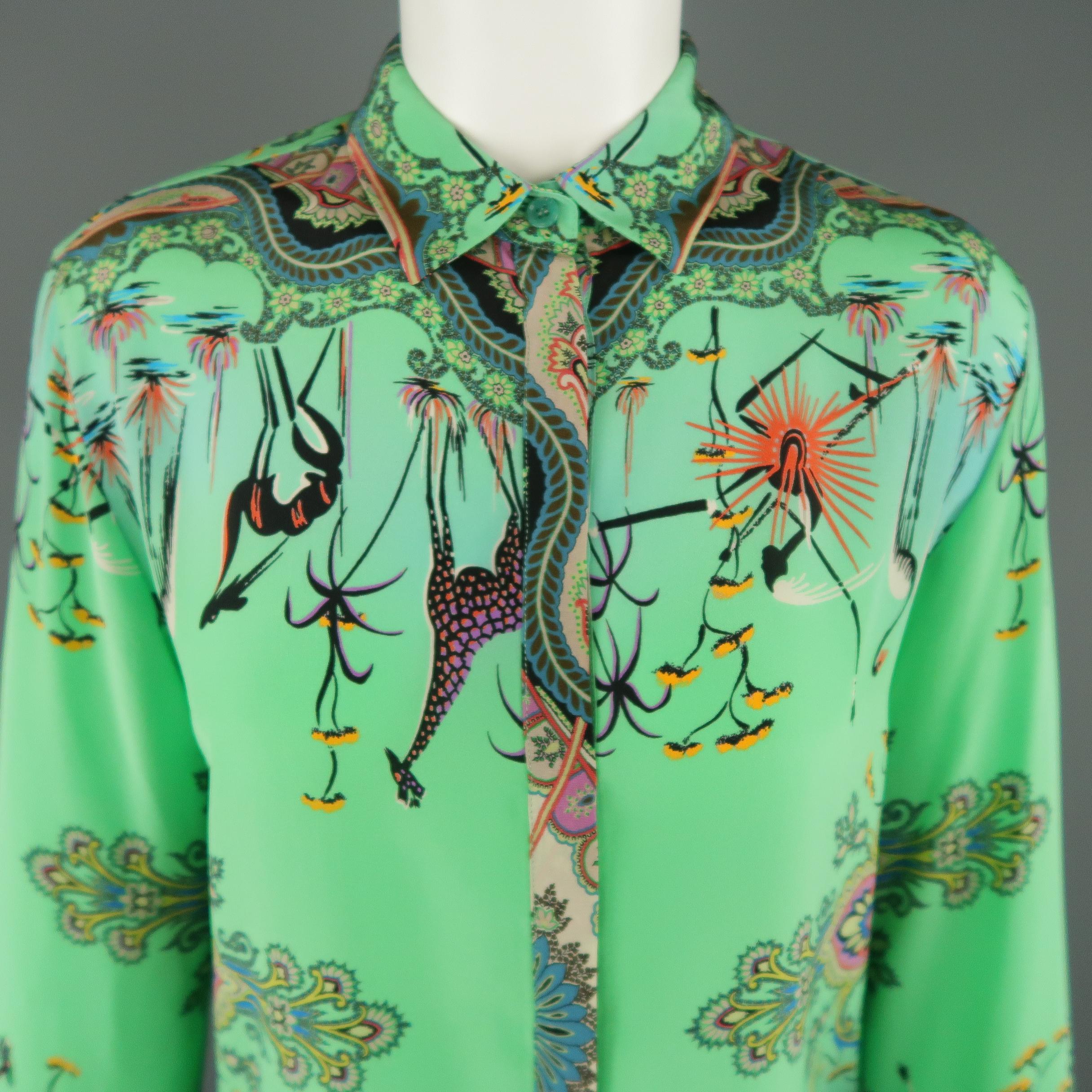 ETRO blouse comes in turquoise silk with a paisley bird print throughout, pointed collar, and hidden placket button closure. Made in Italy.
 
Excellent Pre-Owned Condition. Retails: $1,060.00.
Marked: IT 42
 
Measurements:
 
Shoulder: 15 in.
Chest: