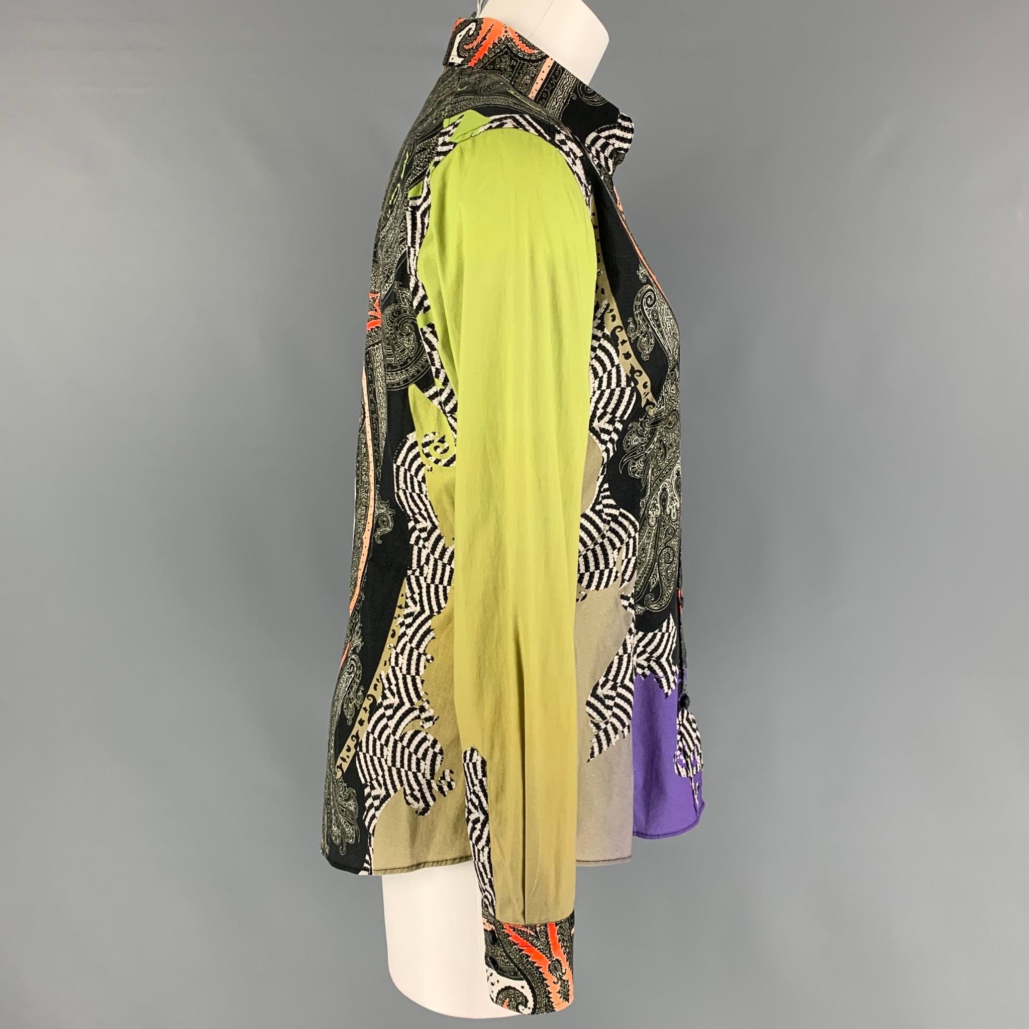 ETRO blouse comes in a multi-color paisley material featuring a spread collar and a button up closure. Made in Italy. 

Very Good Pre-Owned Condition.
Marked: 44

Measurements:

Shoulder: 15.5 in.
Bust: 36 in.
Sleeve: 24.5 in.
Length: 26 in. 