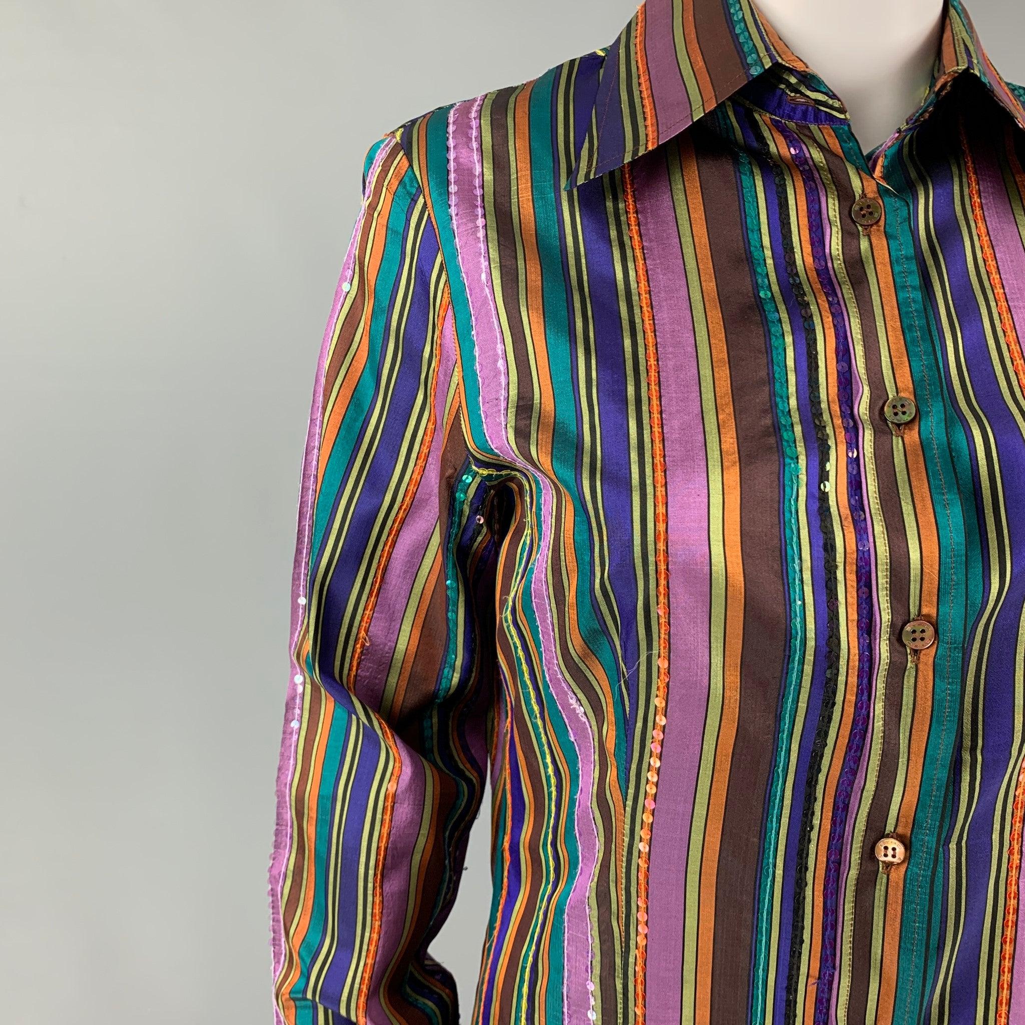 ETRO blouse comes in a multi-color stripe silk featuring a pointed collar, sequined details, and a button up closure. Made in Italy.
Very Good
Pre-Owned Condition. 

Marked:  44 

Measurements: 
 
Shoulder: 16 inches Bust: 34 inches Sleeve: 25