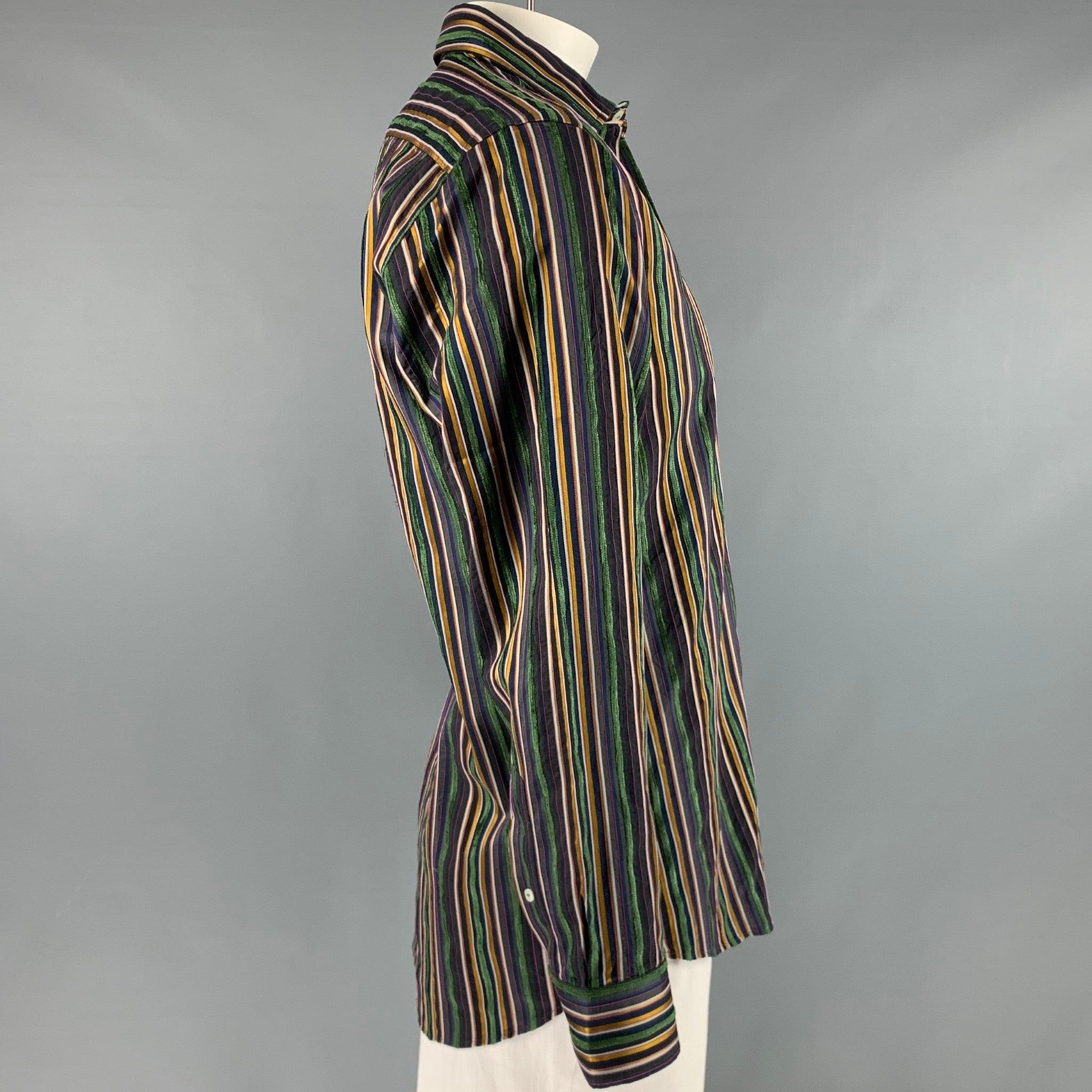 ETRO long sleeve shirt
in a
multi-color cotton blend fabric featuring vertical stripe pattern, textured style, and a button closure. Made in Italy.Very Good Pre-Owned Condition. Minor signs of wear. 

Marked:   42 

Measurements: 
 
Shoulder: 17.5