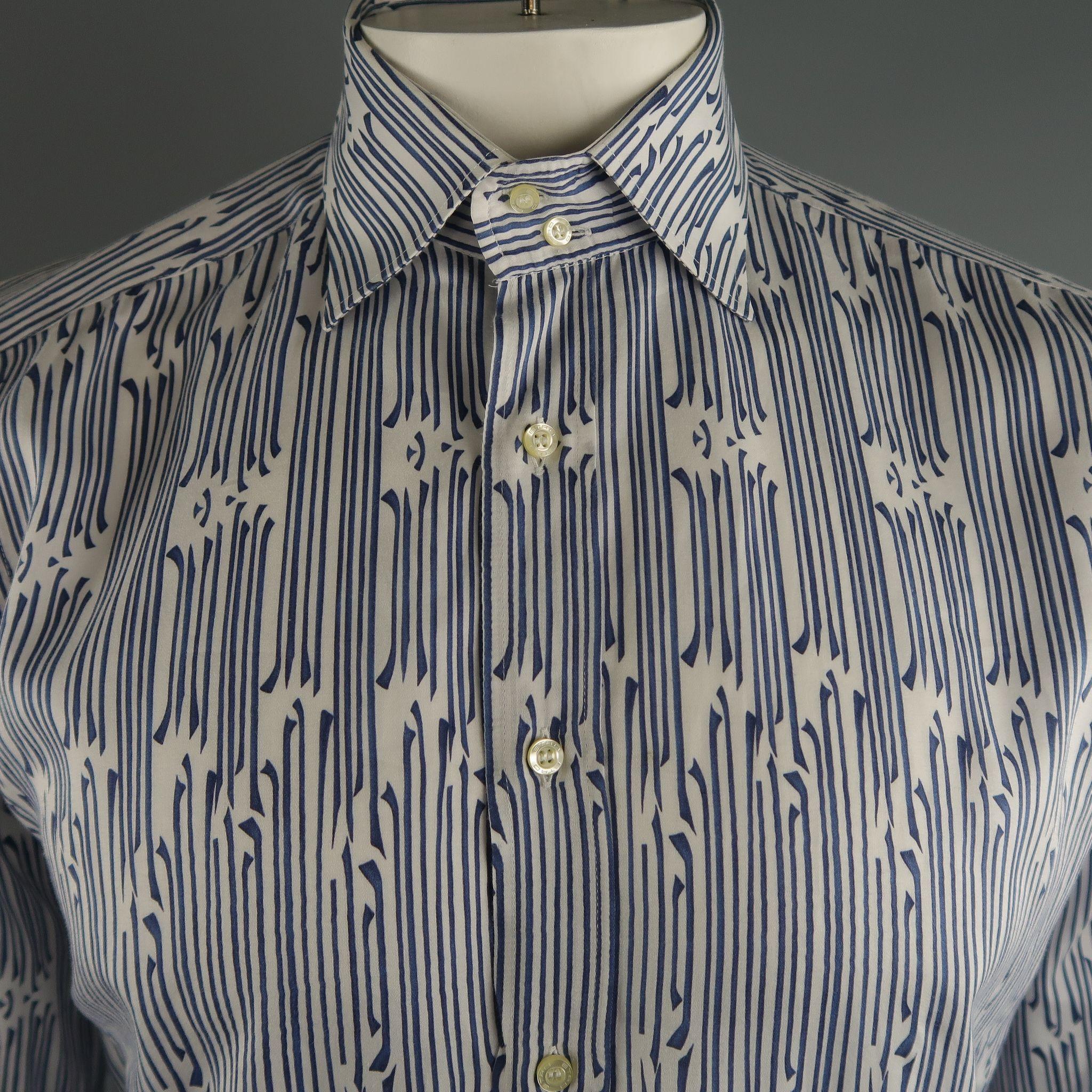 ETRO long sleeve shirt comes in navy and white tones  in printed cotton material, button up. Made in Italy.
 
Excellent Pre-Owned Condition.
Marked: 41
 
Measurements:
 
Shoulder: 16.5  in.
Chest: 46  in.
Sleeve: 24  in.
Length:  31  in.