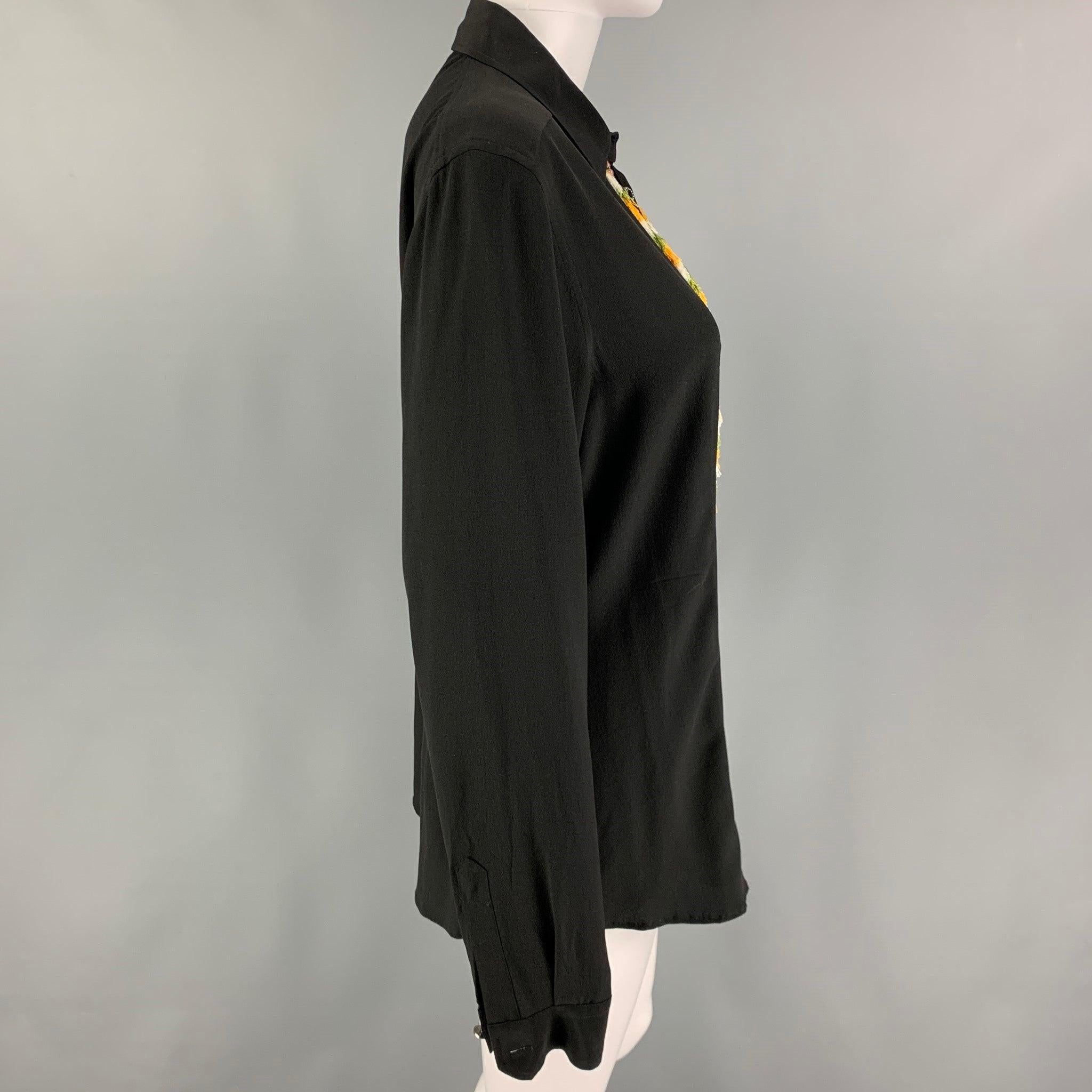 ETRO shirt comes in a black silk featuring a multi-color embroidered design, fringe trim, spread collar, and a button up closure. Includes tags. Made in Italy.
Excellent
Pre-Owned Condition. Missing single button. As-is.  

Marked:   46
