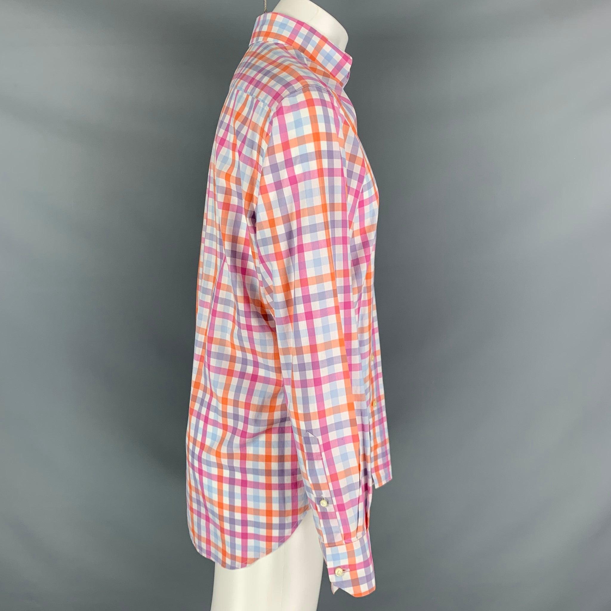 ETRO long sleeve shirt comes in an orange and white checkered cotton featuring a button down collar, embroidery logo, and a button up closure. Made in Italy. Very Good Pre-Owned Condition. 

Marked:   40 

Measurements: 
 
Shoulder: 18.5 inches
